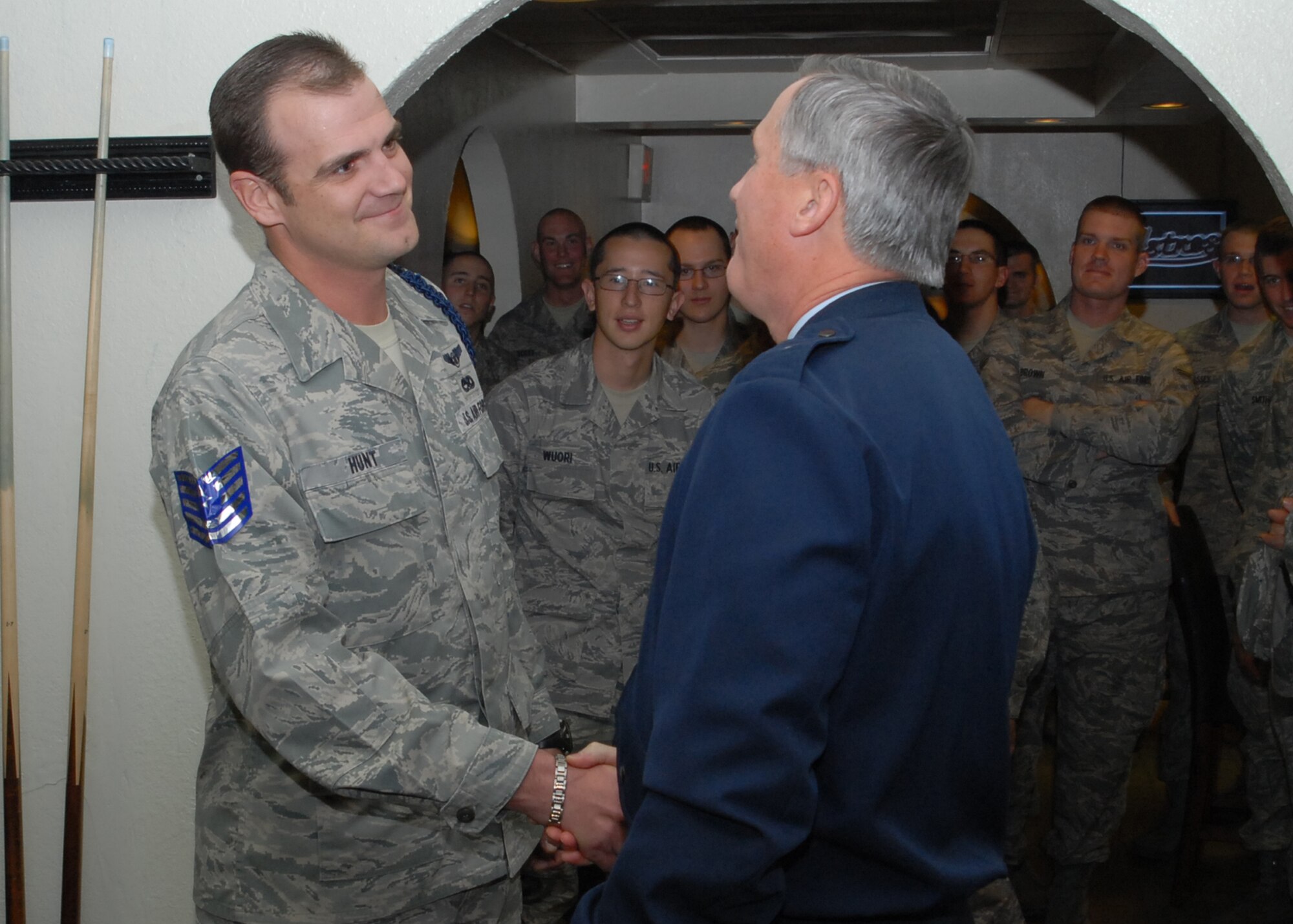 Brig. Gen. O.G. Mannon, congratulates Franklin Hunt, a military training leader at the 365th Training Squadron, for his Stripes for Exceptional Performance promotion to technical sergeant Dec. 12. STEP promotions allow the ranks of staff sergeant to master sergeants to be promoted to the next rank without going through standard testing procedures. (U.S. Air Force photo/Lou Anne Sledge)