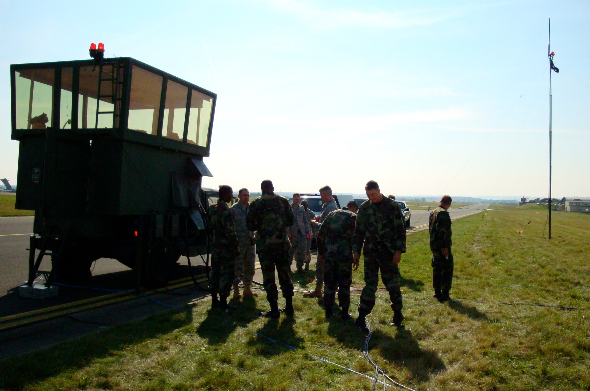 Members of the 1st Combat Communications Squadron prepare to plug in a mobile tower to take over air traffic control at Spangdahlem Air Base while communication is established at the new a multi-million dollar ATC facility. Three teams from the 86th Air and Space Communications Group recently helped get the new tower online by providing hardware and software installation. (Photo courtesy of the 86th Air and Space Communications Group)