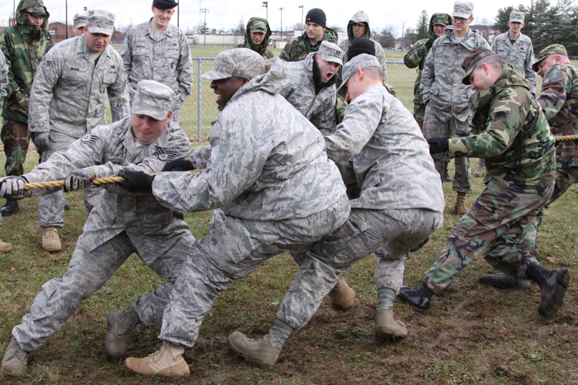 The 816th Contingency Response Group's tug-of-war team fights against the "tug" and the elements during the 621st Contingency Response Wing's Combat Sports day held here, Dec. 12. The tug-of-war was final of the day's seven events which also included a combat relay, ruck march, land navigation, volleyball, pallet build-up and weapons assembly. (U.S. Air Force photo/Staff Sgt. Jonathan Kolasinski)