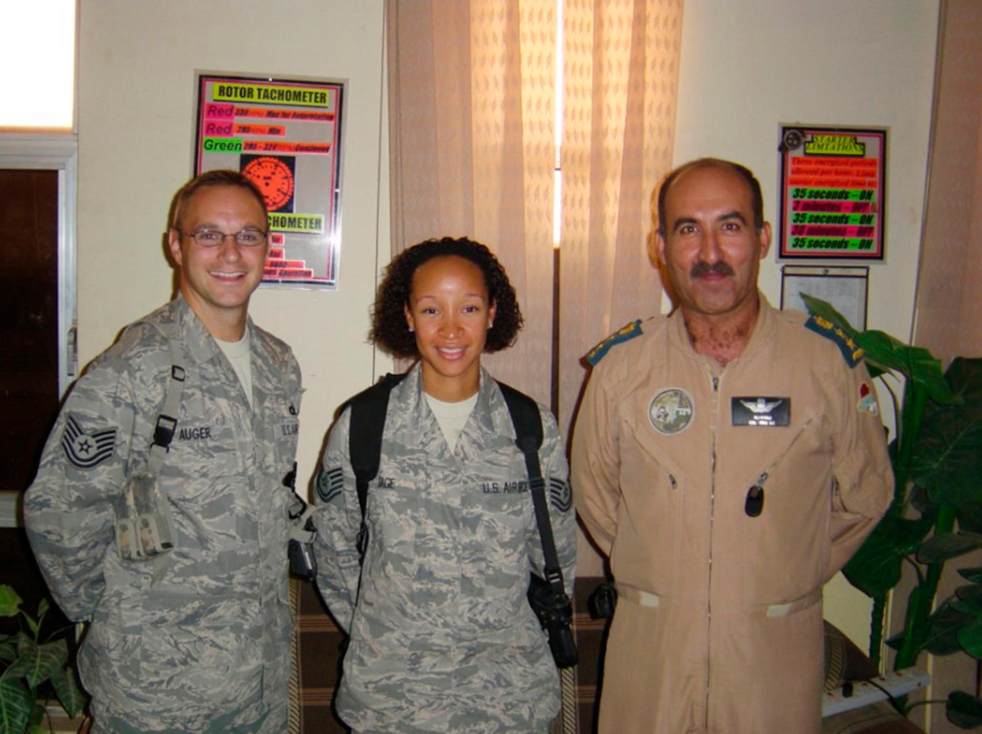 Tech. Sgt. Jamie Auger, Airey NCO Academy instructor, and Tech. Sgt. Erica Gage, Gaylor NCO Academy Instructor from Lackland AFB worked with Col. Ali-H-Naji, 2nd Helicopter Squadron commander to teach professional military education to the Iraqi Air Force’s 500-member commissioned and warrant officer corps at Camp Tiji, Iraq.  (Courtesy photo)