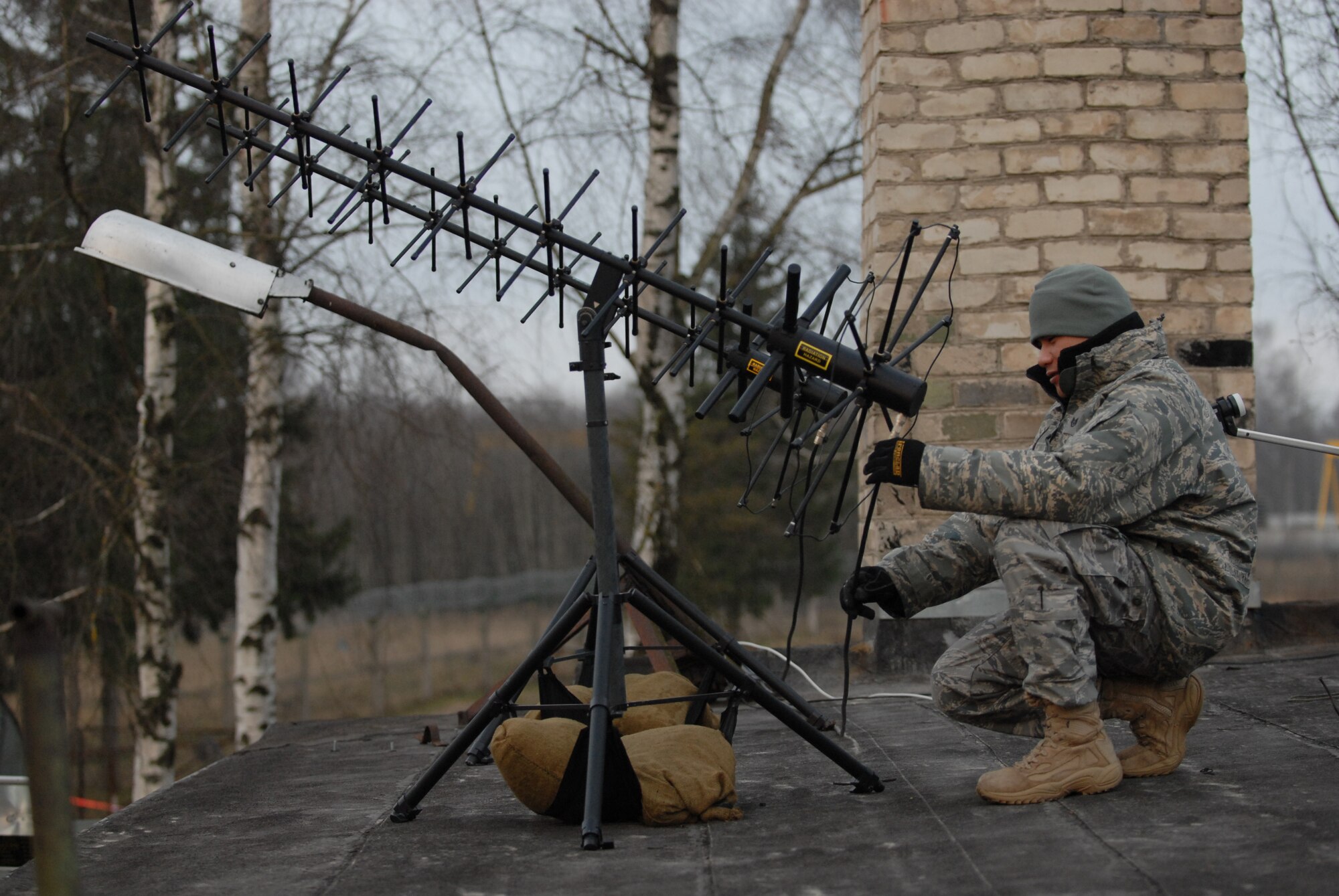Staff Sgt. Gary Vergara conducts a morning visual inspection of 1st Combat Communications Squadron hardware at Šiauliai International Airport, Lithuania, Dec. 3. Ten members of the 1st CBCS are currently providing communications support as the U.S. takes its turn on the Baltic Air Police rotation. (U.S. Air Force photo by Capt. John Ross)