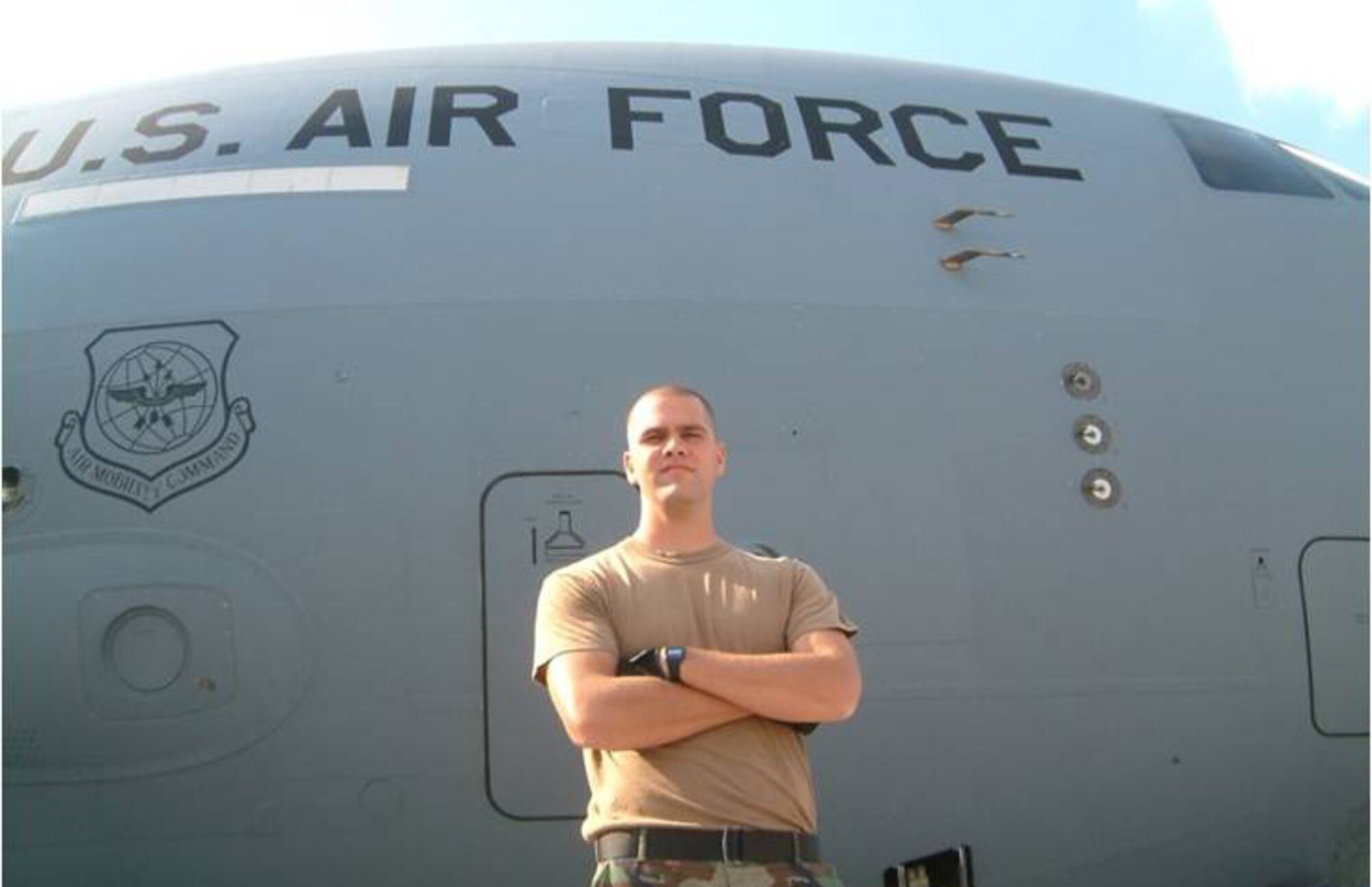 Staff Sgt. Paul Corcoran poses for a “hero shot” in front of a C-17 in Poland while deployed with the 86th Contingency Response Group last fall. Sergeant Corcoran is a Kentucky National Guardsman who accompanied the 86th CRG last fall on a humanitarian mission to Tblisi, Georgia. (Photo courtesy of the 86th Contingency Response Group)