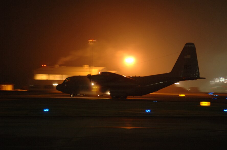 A C-130 Hercules taxi's out to the runway for take-off, Ramstein Air Base, Germany, Dec. 9, 2008. (U.S. Air Force photo by Senior Airman Levi Riendeau)