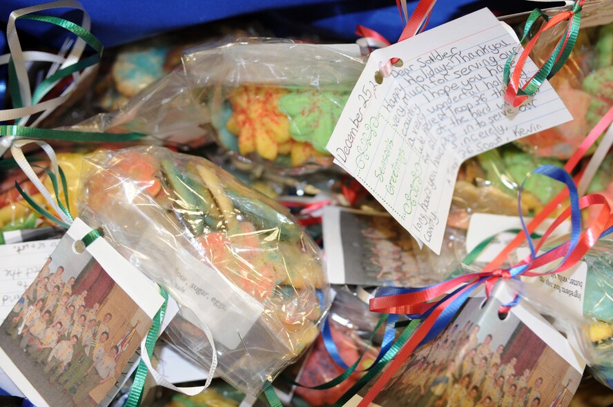 Ian DiFiore, a Boy Scout from NJ, hands out cookies to deployed military members transitioning back to the states at the Contingency Aero-medical Staging Facility as part of his Eagle Scout service project, Ramstein Air Base, Germany Dec. 12, 2008. With the help of 35 scouts, over 175 hours have gone into his service project. (U.S. Air Force photo by Senior Airman Kelly LeGuillon)