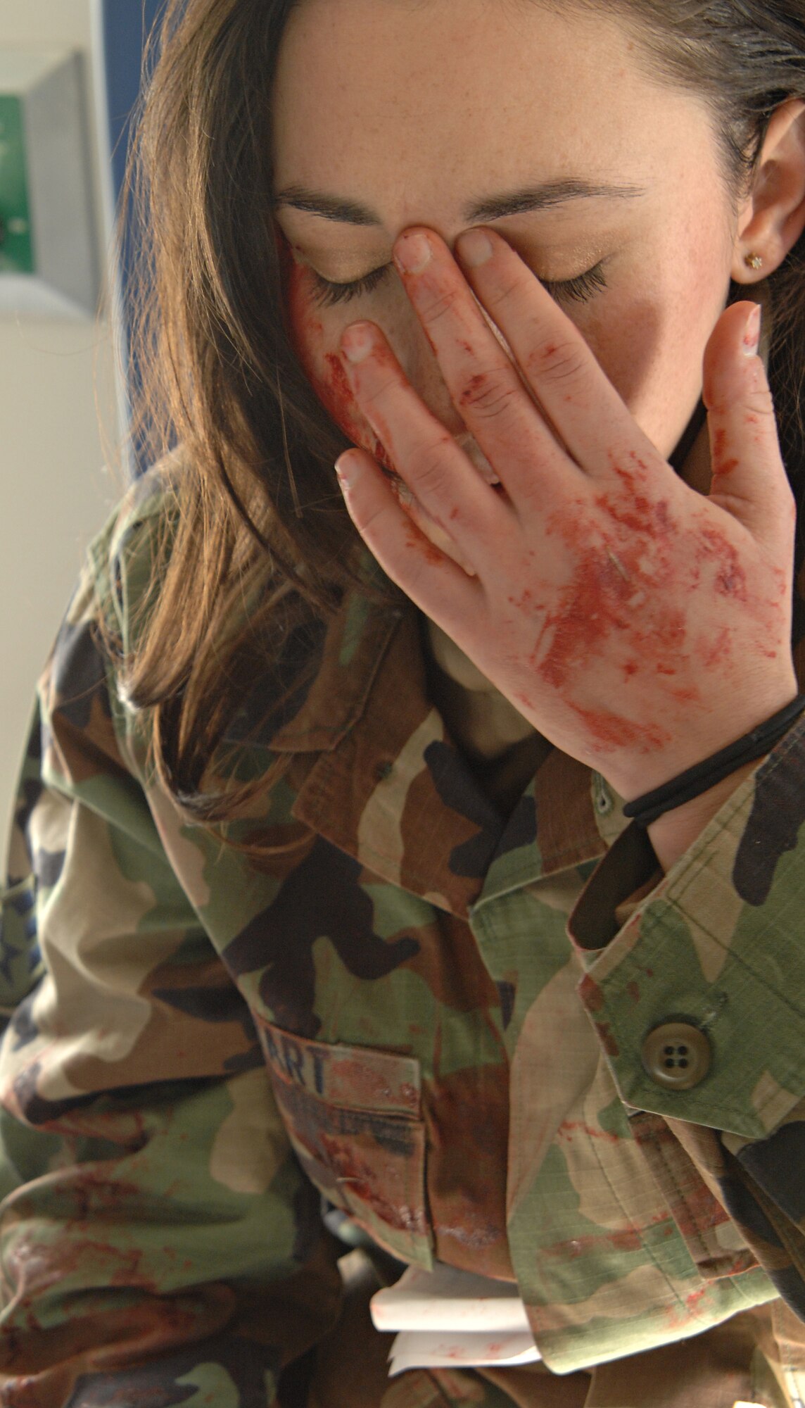 Senior Airman Erica Stewart, 39th Air Base Wing Public Affairs acts as a victim being transported in an ambulance during a major accident response exercise, Dec. 12. The 39 ABW performs a MARE quarterly to help Airmen prepare for real world contingnencies. (U.S. Air Force photo by Senior Airman Benjamin Wilson)