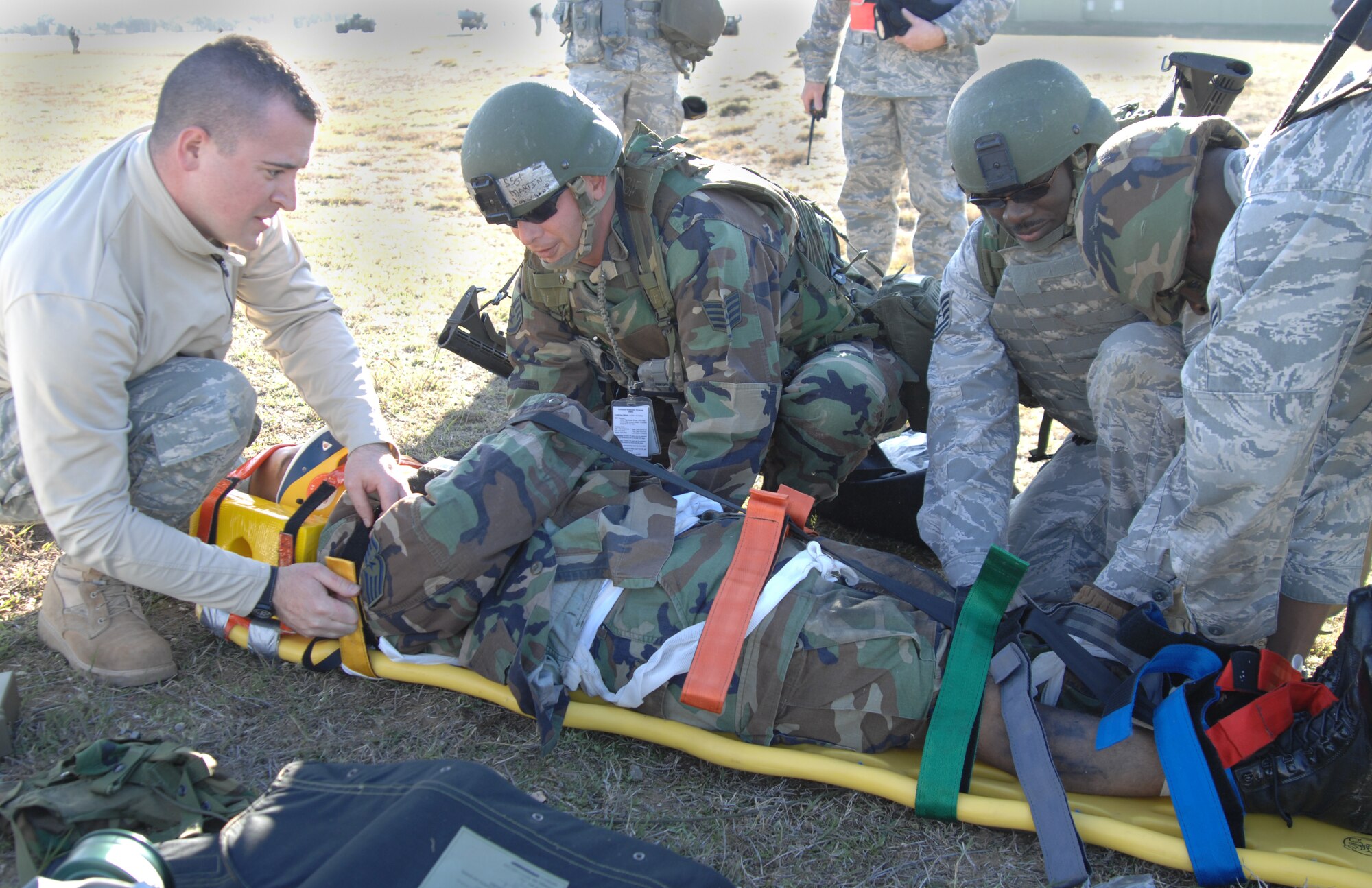 Members of the 39th Security Forces Squadron prepare a moulage victim to transport out of the cordoned area during a major accident response exercise, Dec. 12. The 39 ABW performs a MARE quarterly to help Airmen prepare for real world contingnencies. (U.S. Air Force photo by Senior Airman Benjamin Wilson)