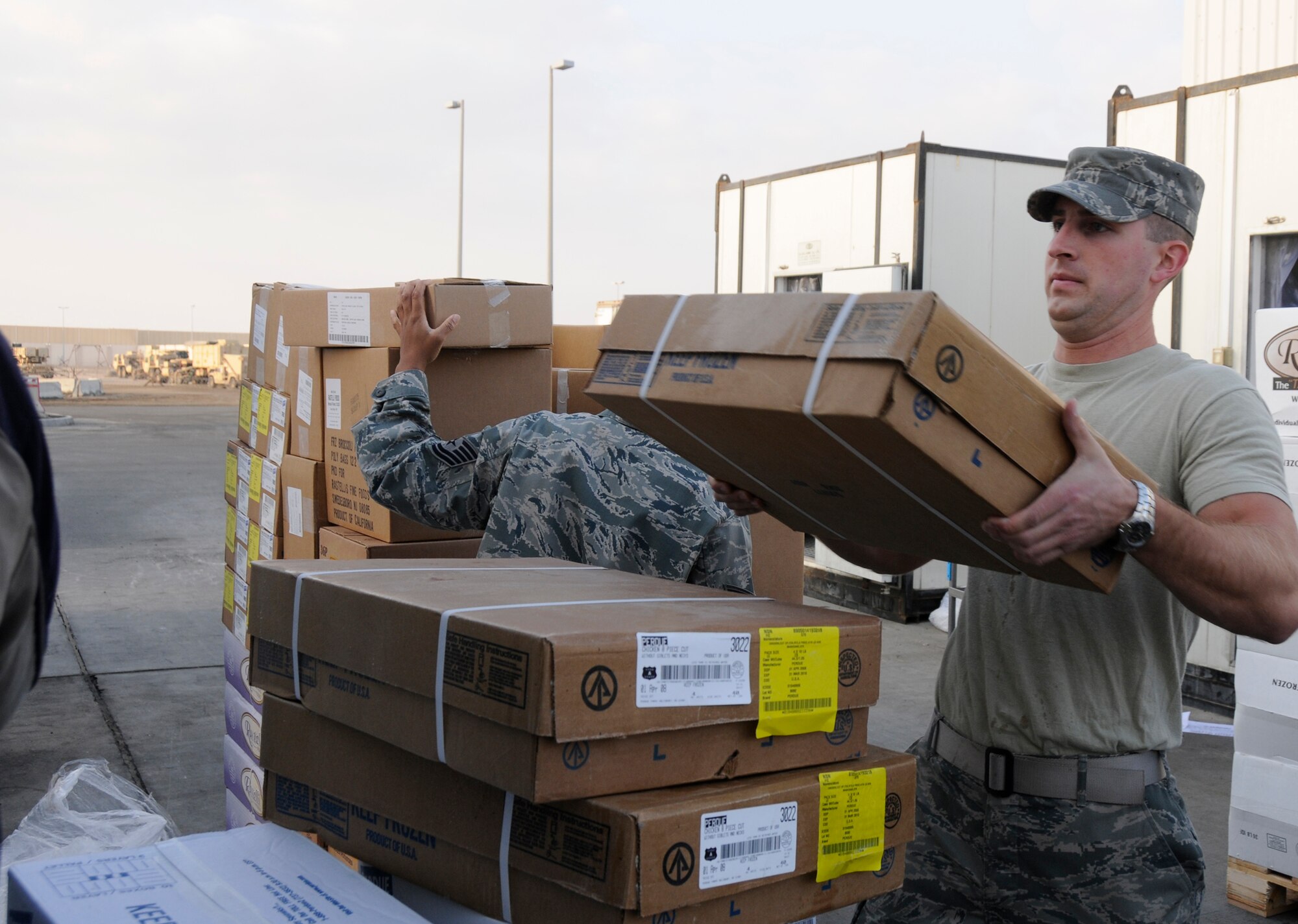 SOUTHWEST ASIA -- Staff Sgt. Ryan Gunderson from the 380th Expeditionary Force Support Squadron helps stock frozen foods here. Sergeant Gunderson works with other members of EFSS three times a week to offload trucks and stock different frozen and dry storage food items. Sergeant Gunderson also inspects all the rations and keeps an inventory to ensure that the food supply does not run out. Sergeant Gunderson is deployed from the 148th FSS, Hill Air Force Base, Utah, his hometown is Eatonville, Wash. (U.S. Air Force photo/Tech. Sgt. Christopher A. Campbell)(released)