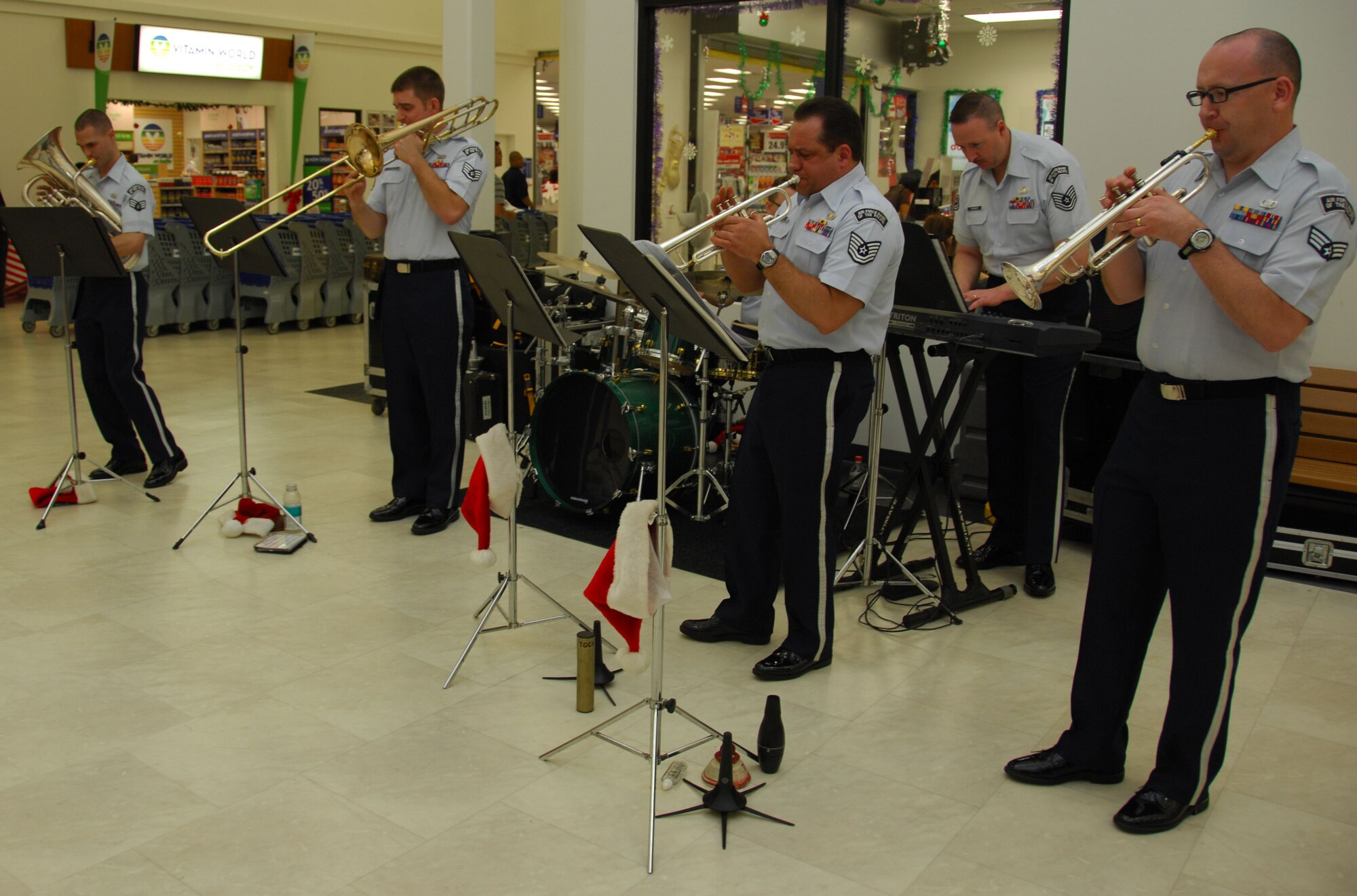 ANDERSEN AIR FORCE BASE, Guam - Members of the Band of the Pacific's Alaska Brass perform a one-hour set of holiday music in the Base Exchange here Dec. 15. The Alaska Brass performs many styles of music, including Baroque and Classical, marches, popular, ragtime, dixie and jazz. (U.S. Air Force photo by Senior Airman Jonathan Hart)
