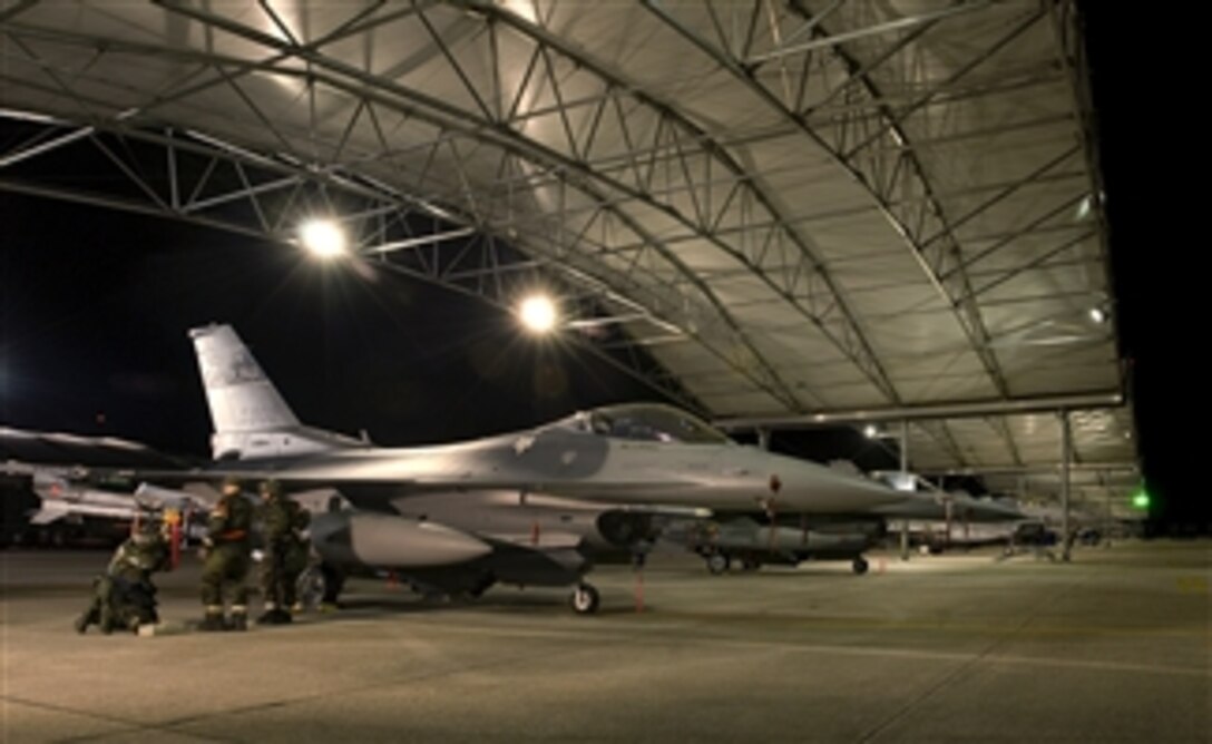 U.S. Air Force F-16 Fighting Falcon jet maintenance personnel assigned to 169th Fighter Wing at McEntire Joint National Guard Base, S.C., prepare for an operational readiness inspection at the base on Dec. 13, 2008.  Operational readiness inspections measure a unit's war fighting capabilities in a combat environment.  