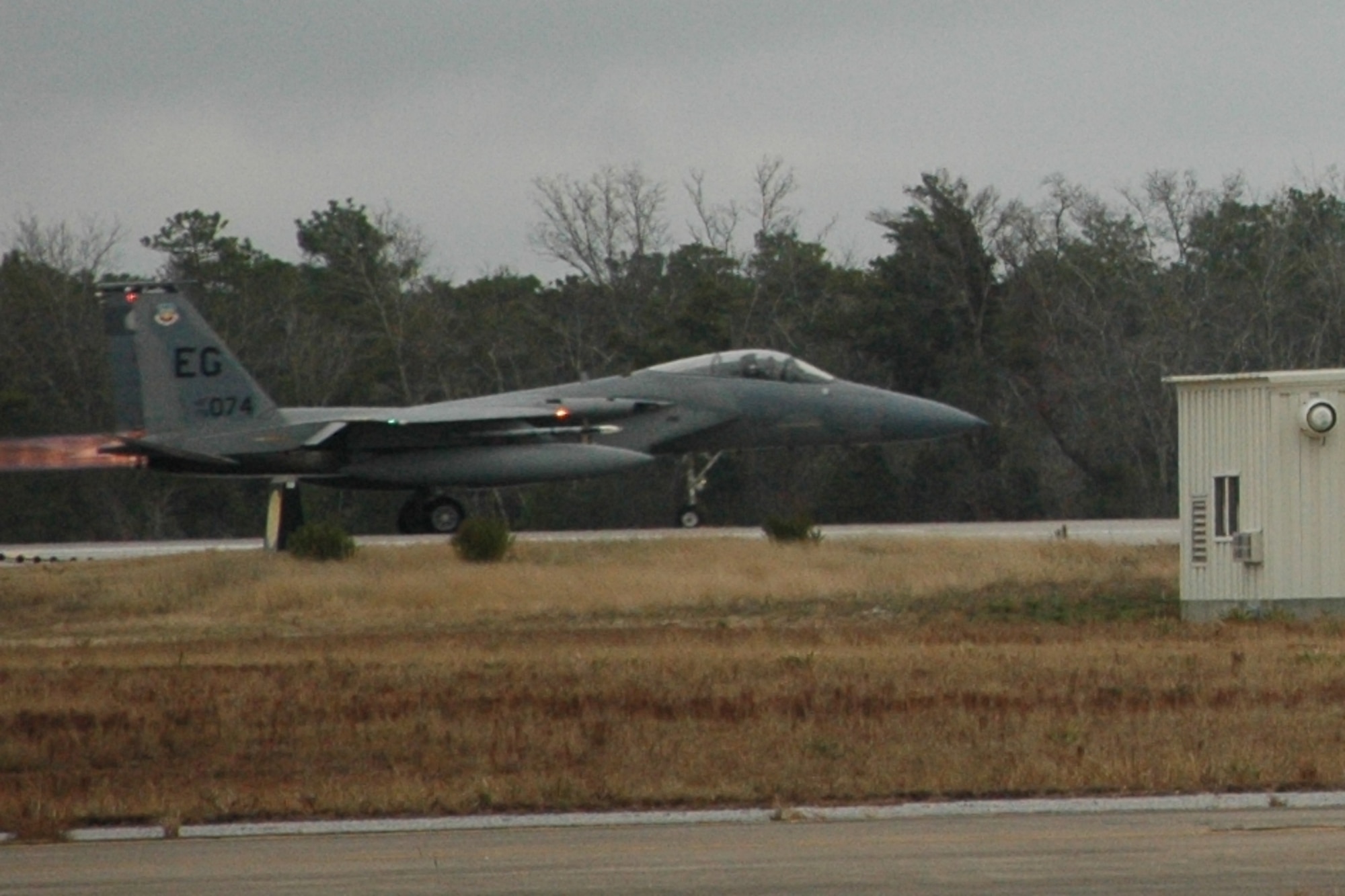 An F-15 Eagle races from an Eglin AFB runway into the sky as air support for a simulated Operation Noble Eagle tasking during a 33rd Fighter Wing exercise Dec. 17. (U.S. Air Force photo/Chrissy Cuttita)