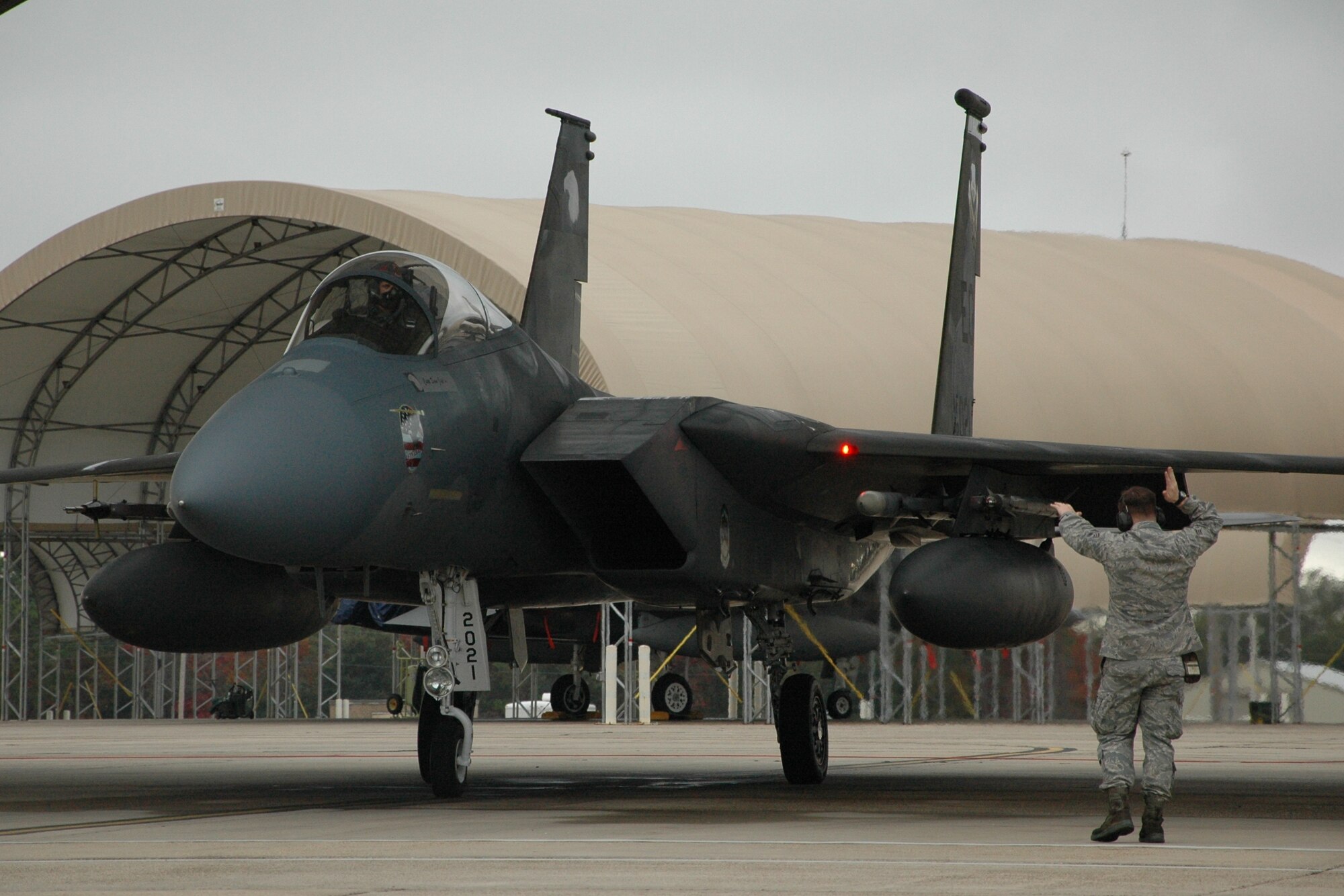 A 58th Aircraft Maintenance Unit crew chief marshals an F-15 Eagle ready to take-off for a simulated Operation Noble Eagle tasking during a 33rd Fighter Wing exercise Dec. 17. (U.S. Air Force photo/Chrissy Cuttita)