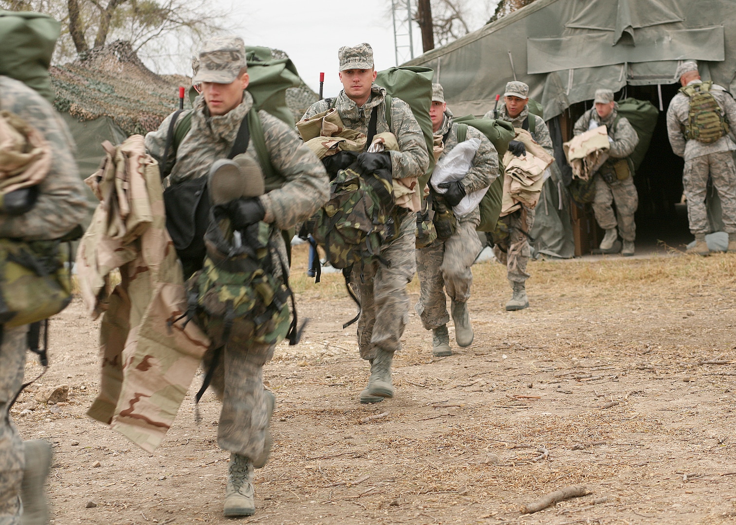 12/15/2008 - Air Force basic military trainees get their gear at the new $28 million Basic Expeditionary Airman Skills Training course at Lackland Air Force Base Dec. 15. At the new BEAST site, trainees will face a series of increasingly difficult exercise events under simulated, realistic, combat conditions, allowing them to practice war skills such as basic self-defense, integrated base defense, self aid and buddy care, and improvised explosive device training. (USAF photo by Robbin Cresswell)  