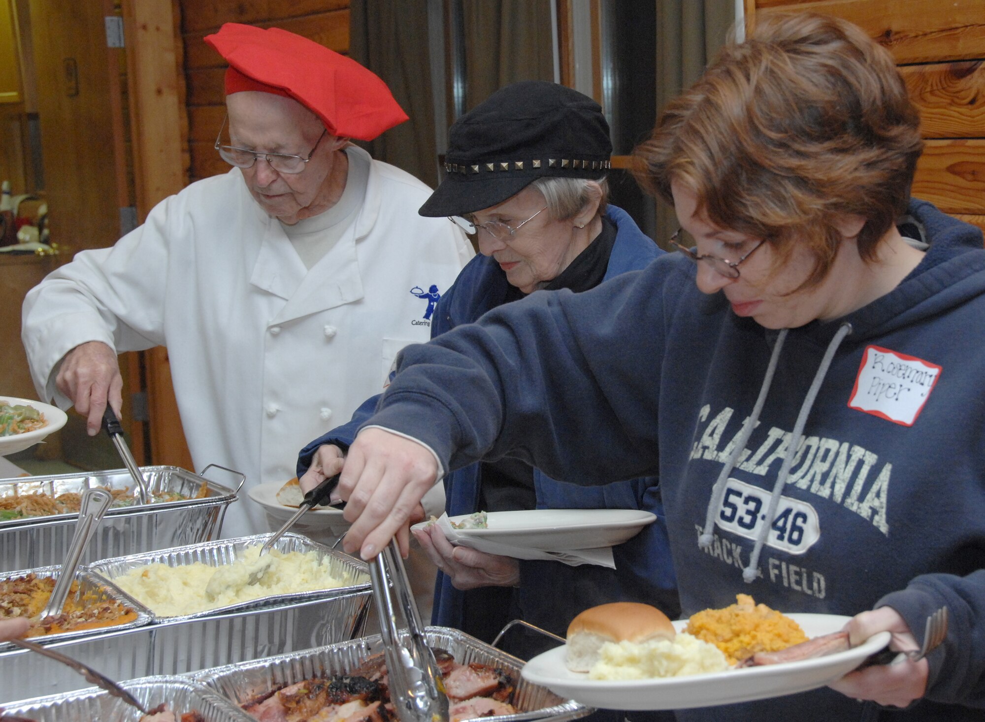 SHAW AIR FORCE BASE, S.C. -- Guests in character for the 'Who Killed Santa Murder Mystery Dinner Theater' enjoy a delicious, home-cooked meal while trying to gather clues about Santa's mysterious death. "I'm trying to institute the idea of providing more programs for families to come here and relax," said Kurt Marshall, Wateree Recreation Area director. (U.S. Air Force photo/2nd Lt. Emily Chilson)