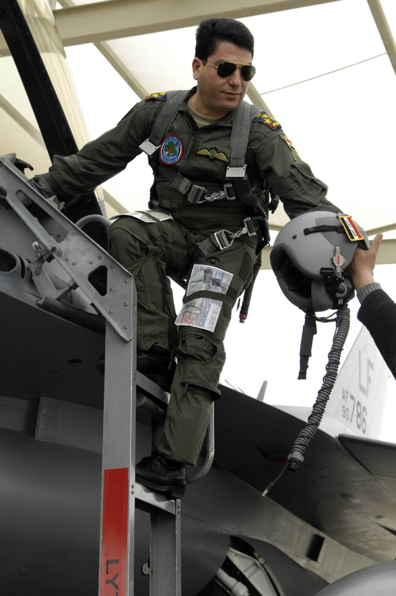 Iraqi Air Force Brig Gen Ali Al-Aaragy enters a 63rd Fighter Squadron F-16 before flight at Luke Air Force Base, Arizona on December 15, 2008.  (Photo by U.S. Air Force Staff Sgt Richard Rose)