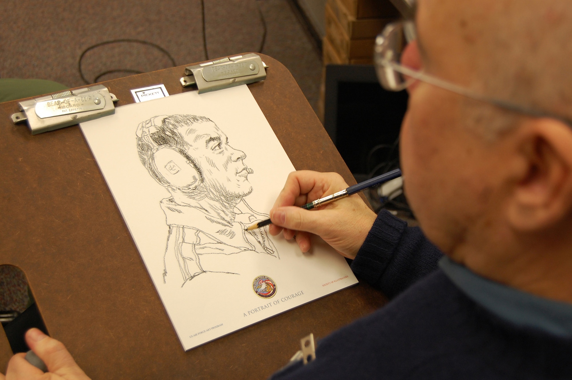 Artist John Witt, chairman of the New York Society Illustrators, makes a sketch of Master Sgt. Troy Coville, Mobility Operations School, Dec. 12, 2008, in the U.S. Air Force Expeditionary Center studio on Fort Dix, N.J.  The effort was part of preparatory work by Mr. Witt to complete a painting highlighting Expeditionary Center Airmen for the Air Force Art Program.  (U.S. Air Force Photo/Staff Sgt. Nathan Bevier)