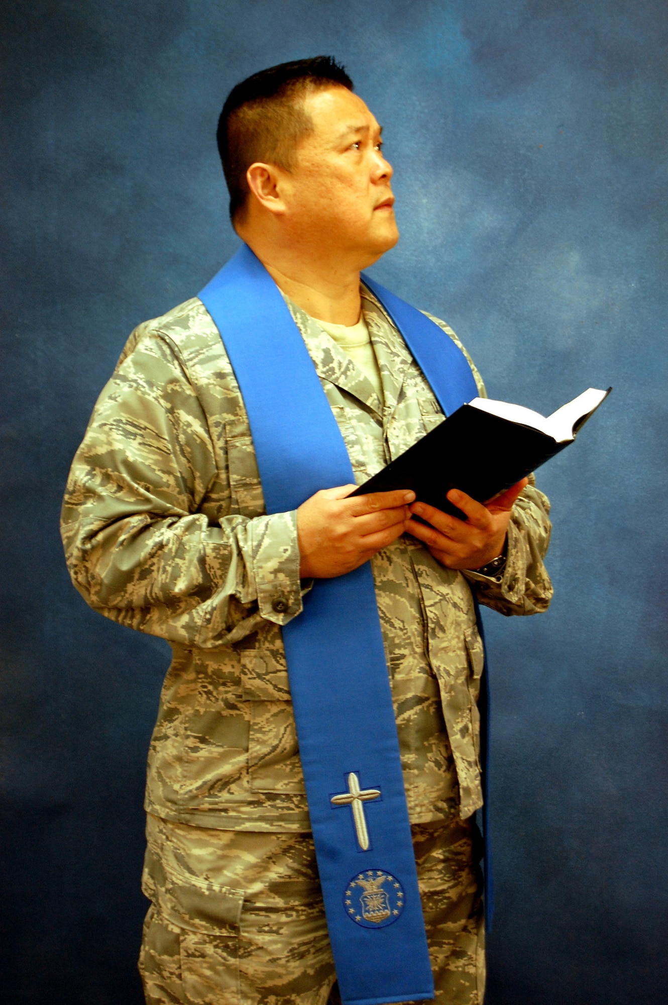 Chaplain (Lt. Col.) Joseph Lim, chaplain for the 305th Air Mobility Wing at McGuire Air Force Base, N.J., models for a photo Dec. 11, 2008, in the U.S. Air Force Expeditionary Center studio on Fort Dix, N.J.  The effort was part of preparatory work by an artist from the Air Force Art Program to complete a painting highlighting the Expeditionary Center. (U.S. Air Force Photo/Tech. Sgt. Scott T. Sturkol)