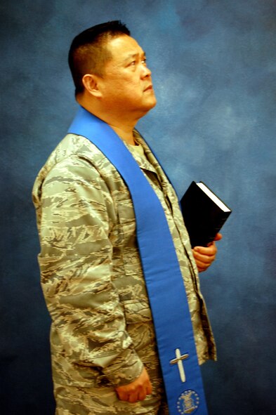 Chaplain (Lt. Col.) Joseph Lim, chaplain for the 305th Air Mobility Wing at McGuire Air Force Base, N.J., models for a photo Dec. 11, 2008, in the U.S. Air Force Expeditionary Center studio on Fort Dix, N.J.  The effort was part of preparatory work by an artist from the Air Force Art Program to complete a painting highlighting the Expeditionary Center. (U.S. Air Force Photo/Tech. Sgt. Scott T. Sturkol)