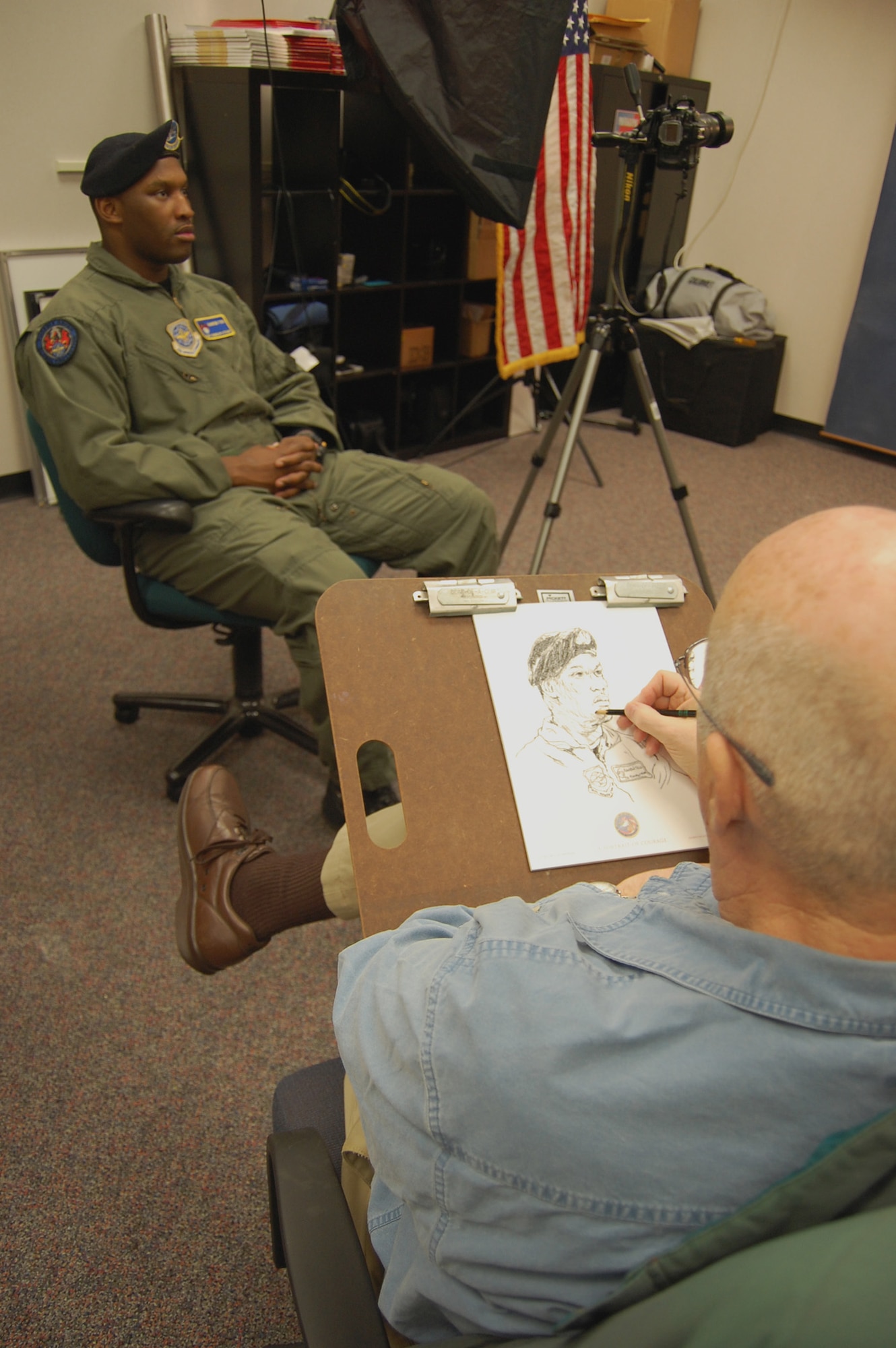 Artist John Witt, chairman of the New York Society Illustrators, sketches Tech. Sgt. Rudolph Stuart, security forces contingency skills instructor with the U.S. Air Force Expeditionary Center's 421st Combat Training Squadron, Dec. 11, 2008, in the Expeditionary Center studio on Fort Dix, N.J.  The effort was part of preparatory work by an Mr. Witt to complete a painting highlighting Expeditionary Center Airmen for the Air Force Art Program.  (U.S. Air Force Photo/Tech. Sgt. Scott T. Sturkol)