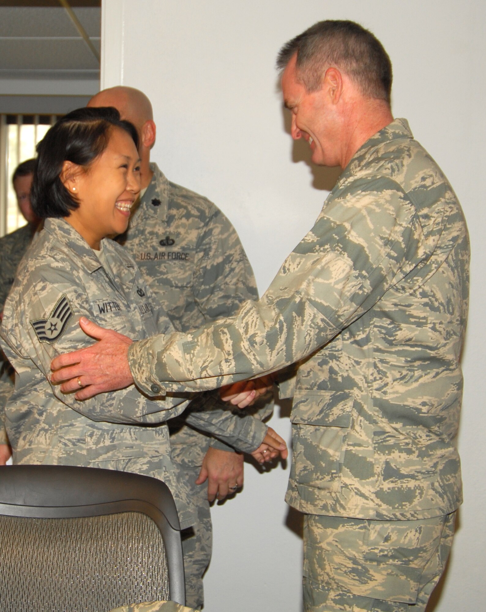 Tech. Sgt. Frances Wittenberg, Tyndall Airman Leadership School instructor, is conragulated by 325th Fighter Wing Commander, Brig. Gen. Darryl Roberson, for being STEP promoted to the rank of technical sergeant here today.   (U.S. Air Force photo/Lisa Norman)