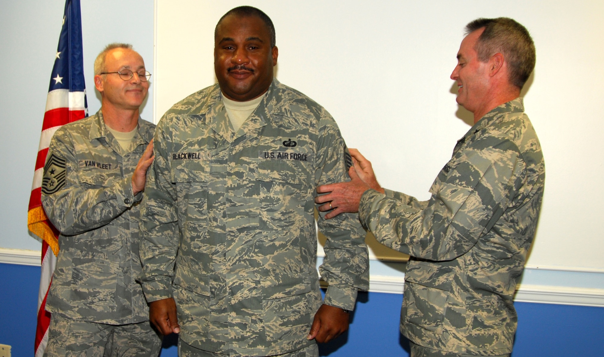 Master Sgt. Devon Blackwell, 325th Comptroller Squadron financial analyst, receives a STEP promotion from 325th Fighter Wing Commander, Brig. Gen. Darryl Roberson and Chief Master Sgt. Benjamin Van Vleet, 325th FW command chief master sergeant today.  (U.S. Air Force photo/Lisa Norman)