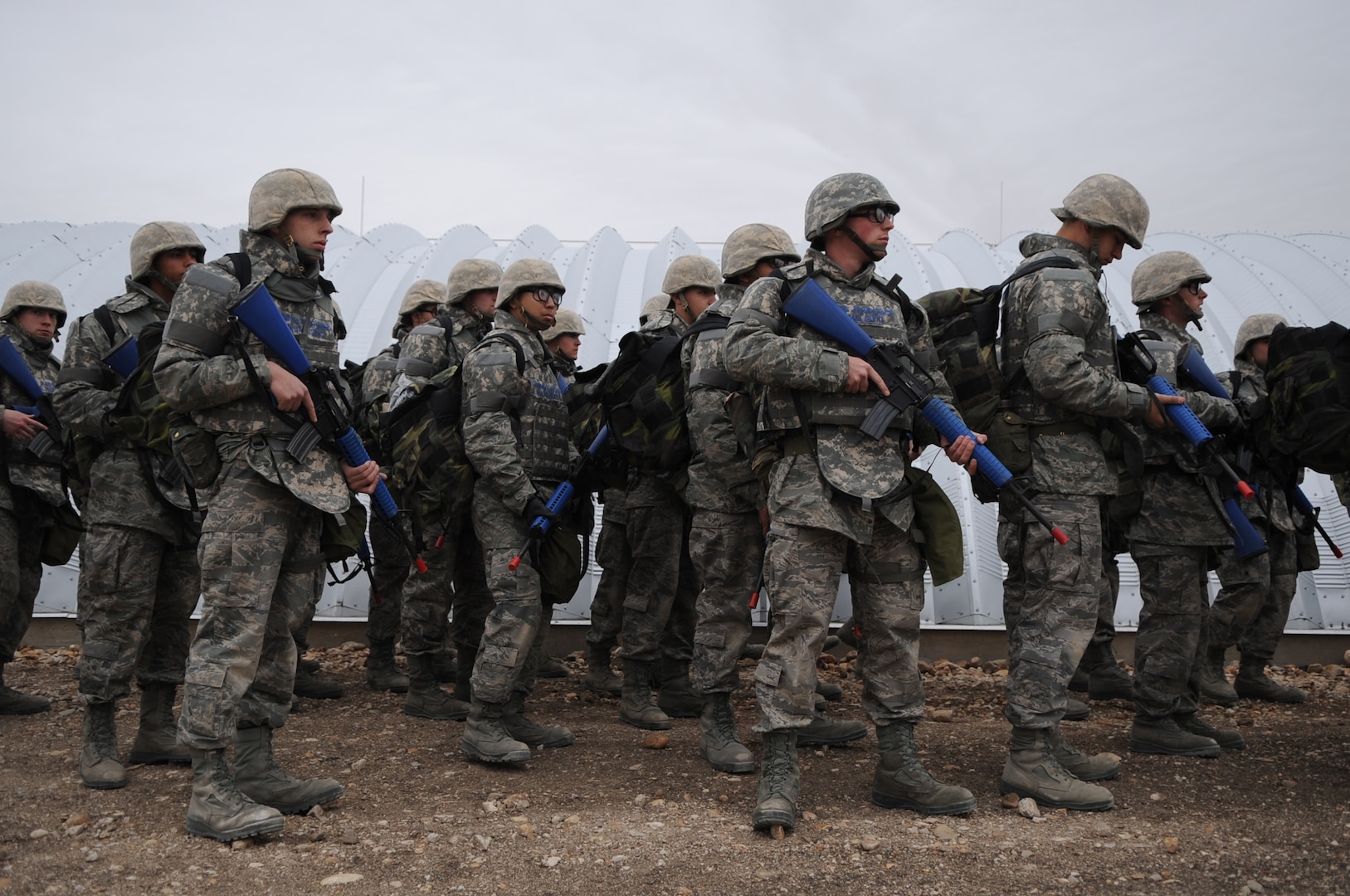 Airmen Basic trainees in body armor wait their turn to go through an unexploded ordnance disposal training lesson during the five-day deployment exercise called the Basic Expeditionary Airman Skills and Training, or BEAST, which kicked off Dec. 15 at Lackland Air Force Base, Texas. The BEAST is the newly built complex added into the extended, 8.5-week Basic Military Training curriculum that began Nov. 5. (U.S. Air Force photo/Staff Sgt. Desiree N. Palacios) 