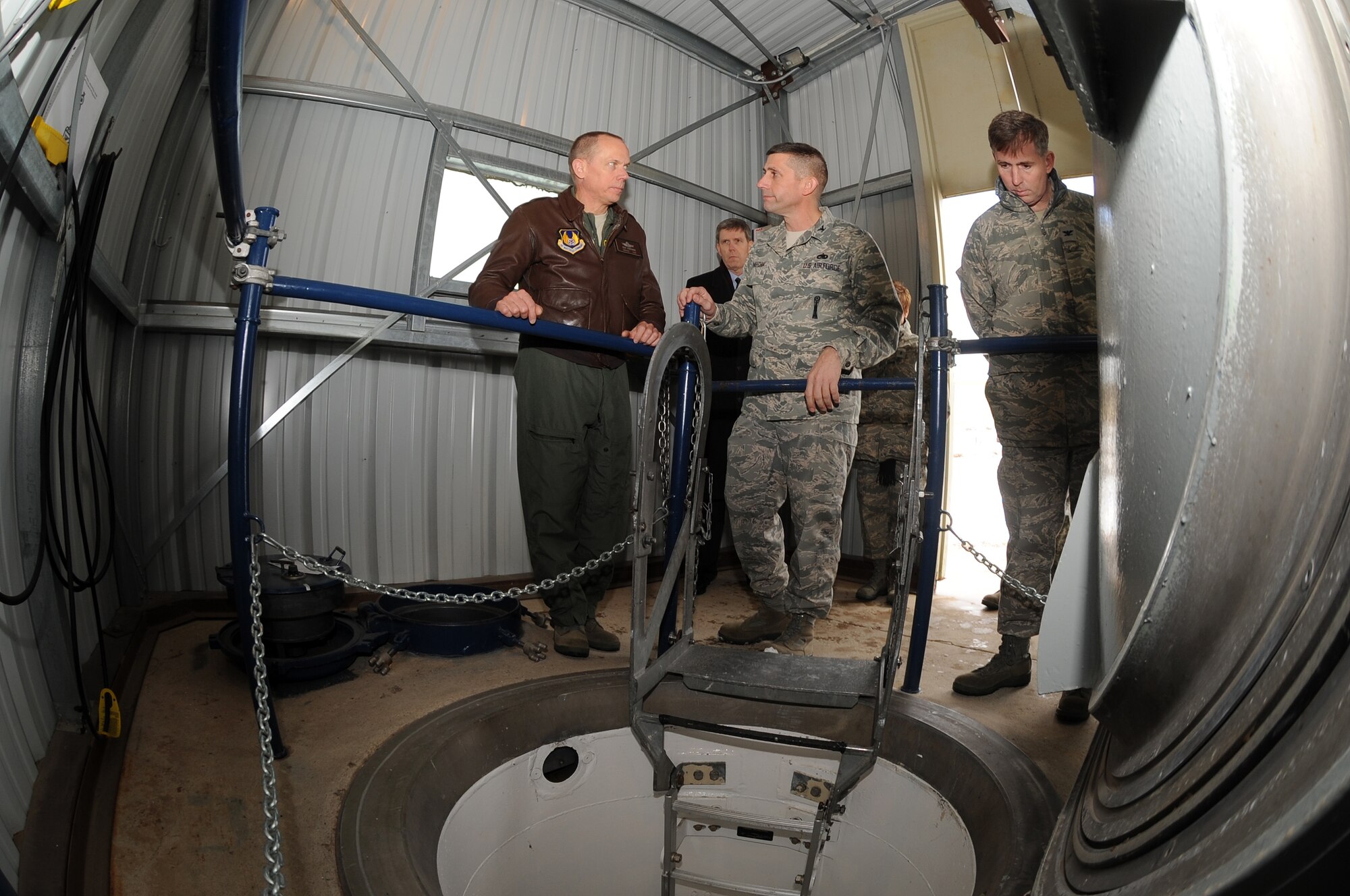 Gen. Donald Hoffman, Commander of Air Force Materiel Command, receives a briefing on Team Hill's role in Intercontinental Ballistic Missile maintenance from Col. Tymofichuk, 309th Maintenance Group Commander, at the Strategic Missile Integration Complex while Mr. Mark Johnson, Ogden Air Logistics Center Executive Director, Maj. Gen. Kathleen Close, OO-ALC Commander and Col. Robert Hyde, special assistant to AFMC commander on nuclear matters accompany him during his very visit to Hill AFB Tuesday.