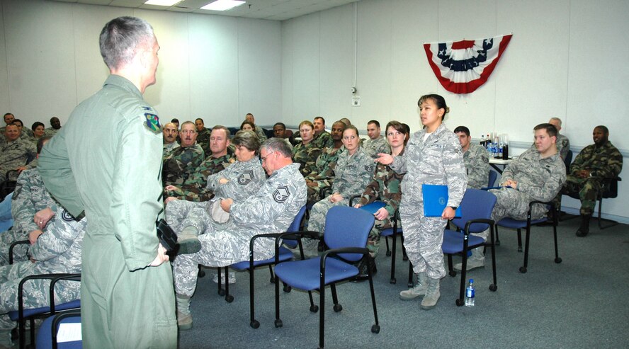 Senior Airman Michelle Balabagno, 919th Maintenance Squadron information management journeyman, tells Col. Steven Chapman, 919th Special Operations Wing Commander, about the skills she and fellow classmates learned while attending Duke Field's NCO Leadership Development Course.  Also shown are Airmen attending the NCOLDC graduation Dec. 5 in the 919th Civil Engineer Squadron's Bull Pen conference room.  The course was conducted in two segments -- Oct. 27-31 and Dec. 1-5. The course provides skills, knowledge, and attributes needed to enhance enlisted leadership. (U.S. Air Force photo by James P Brock III)