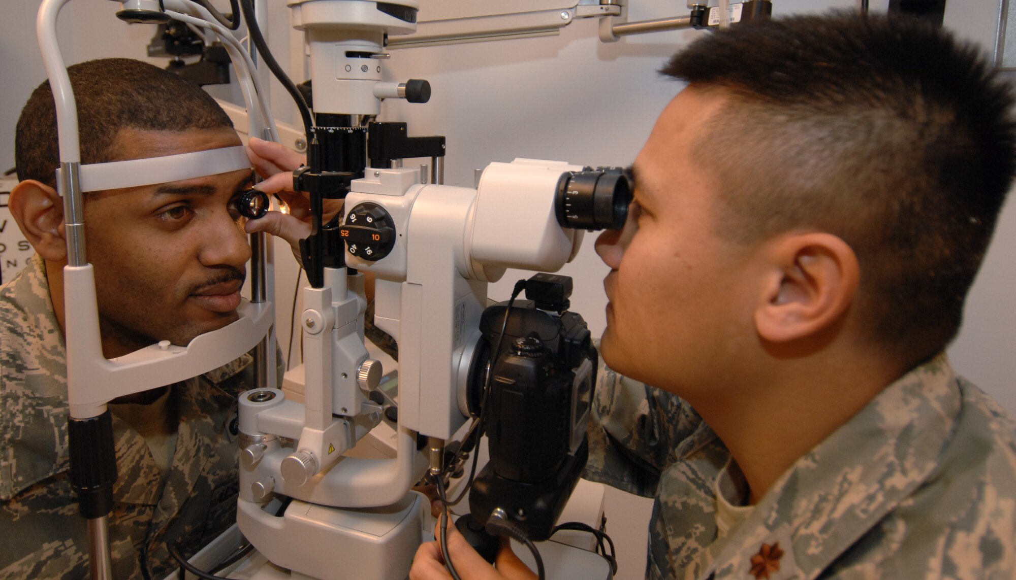 Maj. Cang Bui, 39th Medical Operations Squadron, Optometry Flight commander, examines Tech. Sgt. Christopher Jones, 39th Force Support Squadron, during a routine checkup Dec. 4 (U.S. Air Force photo by Senior Airman Benjamin Wilson)