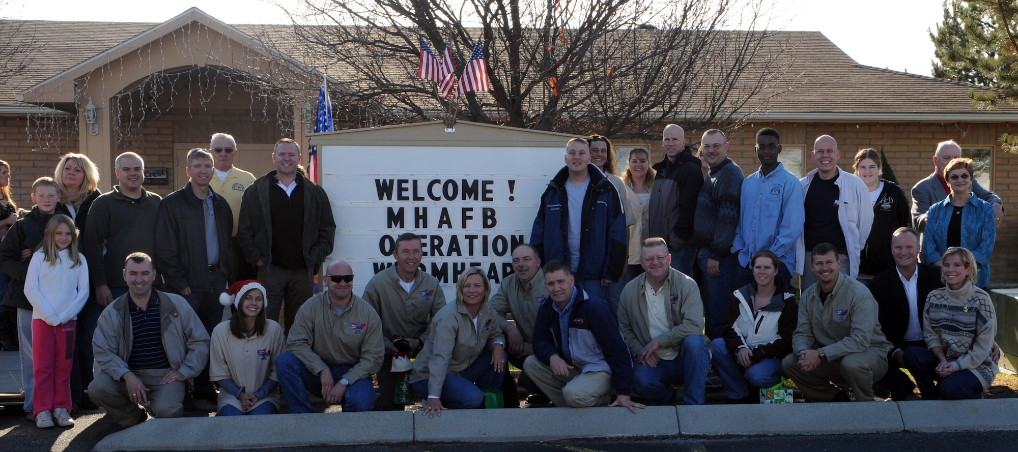 MOUNTAIN HOME AIR FORCE BASE, Idaho - Members of Operation Warmheart pose for a picture after a ceremony honoring Operation Warmheart in the Silvercrest community of Nampa, Idaho, Dec. 6. The ceremony served as a way for the residents of Silvercrest to show their appreciation for Operation Warmheart, a non-profit organization that provides temporary assistance to military personnel and certain individuals and agencies from the local community. (U.S. Air Force photo/Airman Debbie Lockhart)