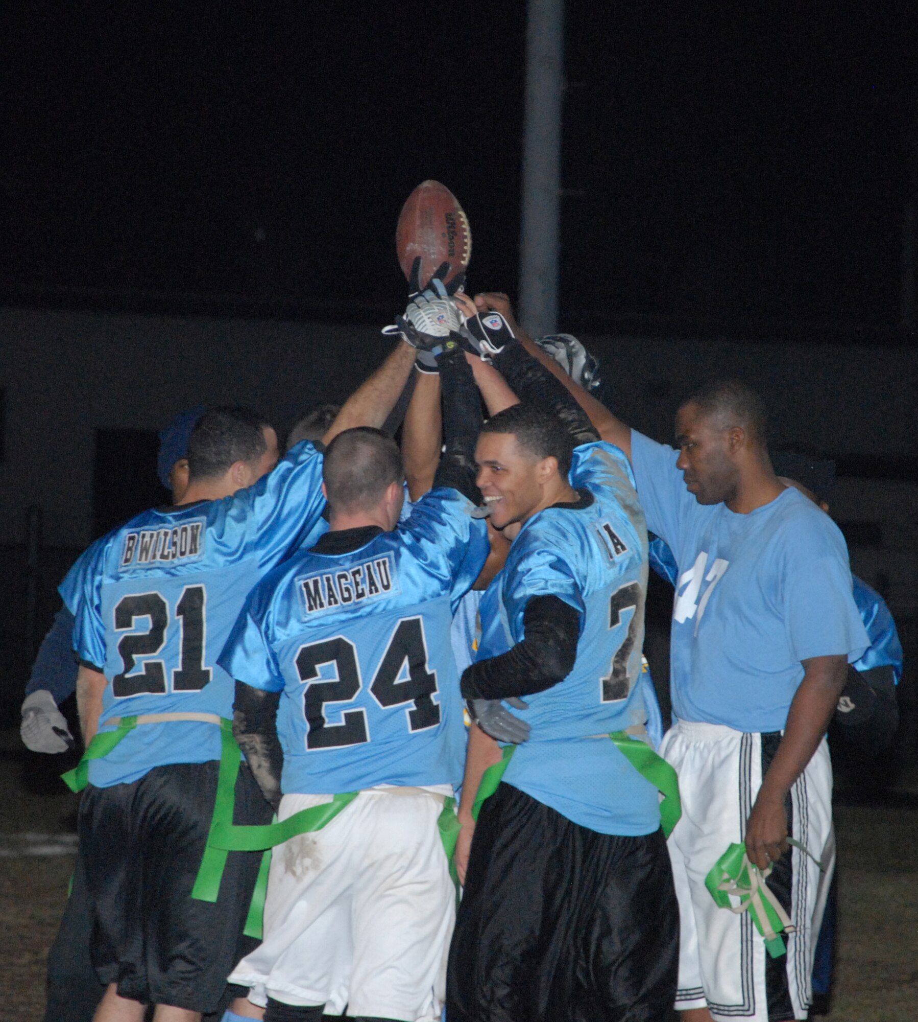 436th Maintenance Squadron celebrates after winning the Intramural Flag Football championship Dec. 15.  They defeated the 436th Civil Engineer Squadron 19-0. 