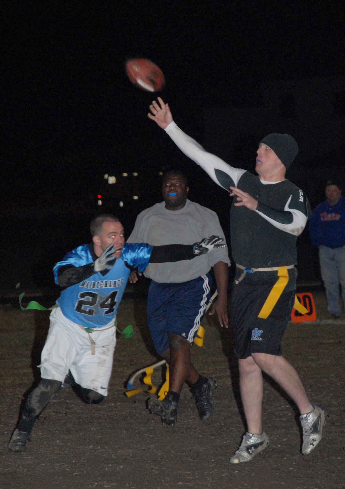 Joe Mageau, 436th Maintenance Squadron lineman, attempts to sack Kenneth Yetter, 436th Civil Engineer Squadron quarterback, during the Intramural Flag Football Championship game Dec. 15.  MXS defeated CES 19-0.