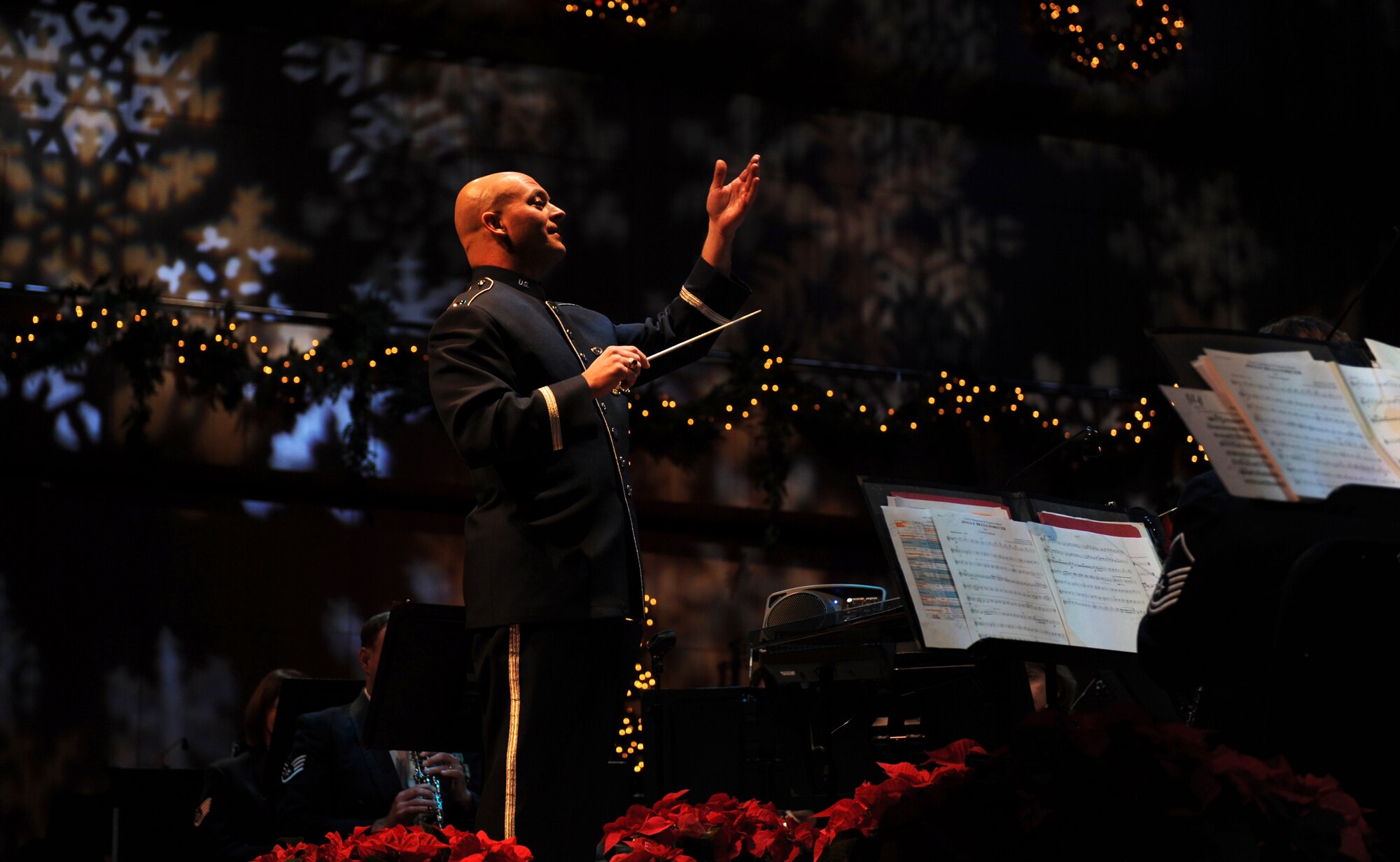 OFFUTT AIR FORCE BASE, Neb. -- 1st Lt. Michael D. Hoerber, Heartland of America Band deputy commander, leads the concert band in a selection during their annual holiday performance held at the Holland Performing Arts Center, Dec. 12. This was the 22nd annual holiday concert put on by the Heartland of America Band. 

U.S. Air Force Photo by Josh Plueger