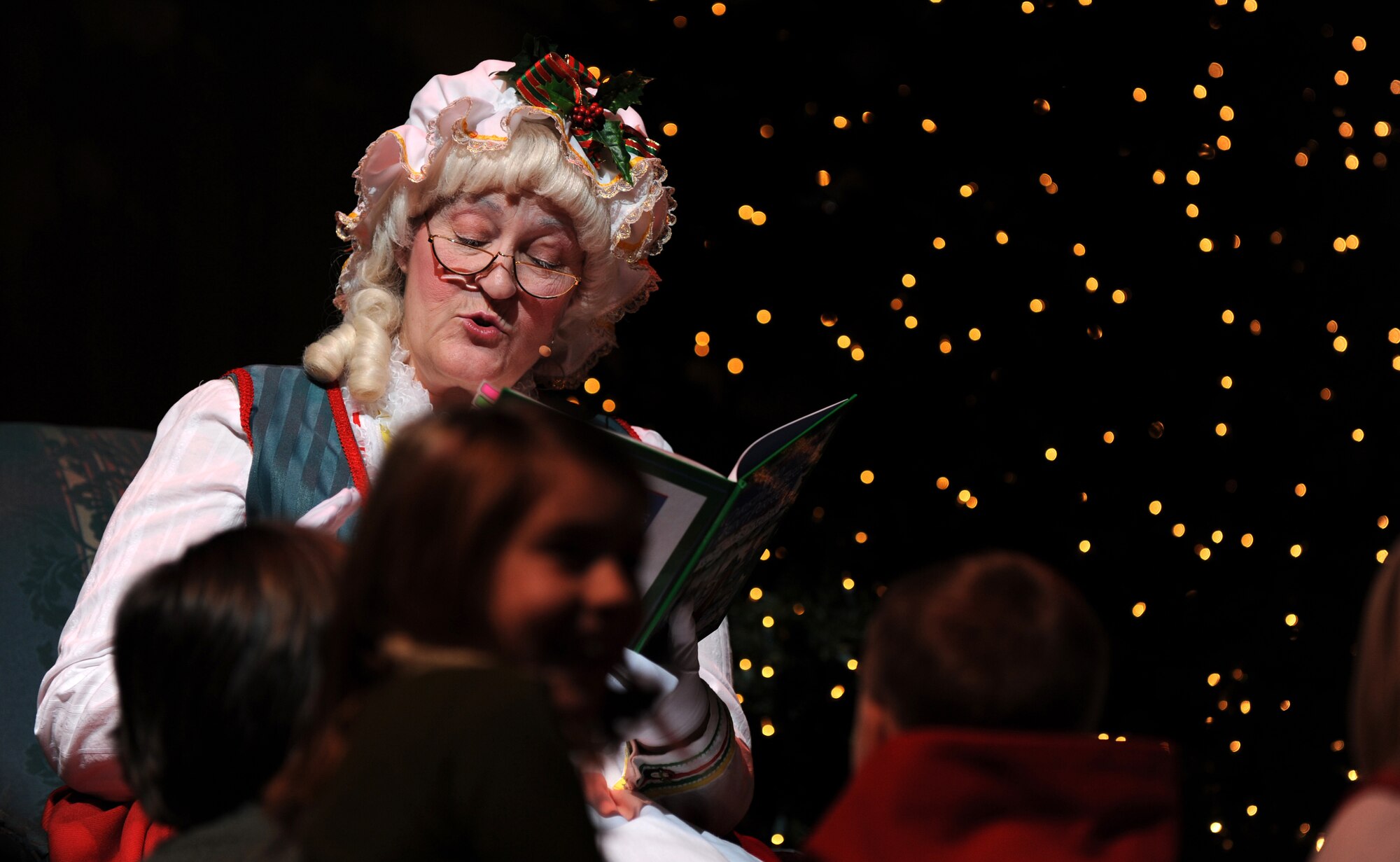 OFFUTT AIR FORCE BASE, Neb. -- Several lucky children join Mrs. Clause on the Holland Perfroming Arts Center stage Dec. 12 as part of the annual Heartland of America Band's holiday concert while she read them "Why Christmas Trees Aren't Perfect."  The Heartland of America Band performed to a full capacity audience of roughly 2,000 metro area residence as part of a four day concert series.

U.S. Air Force Photo by Josh Plueger