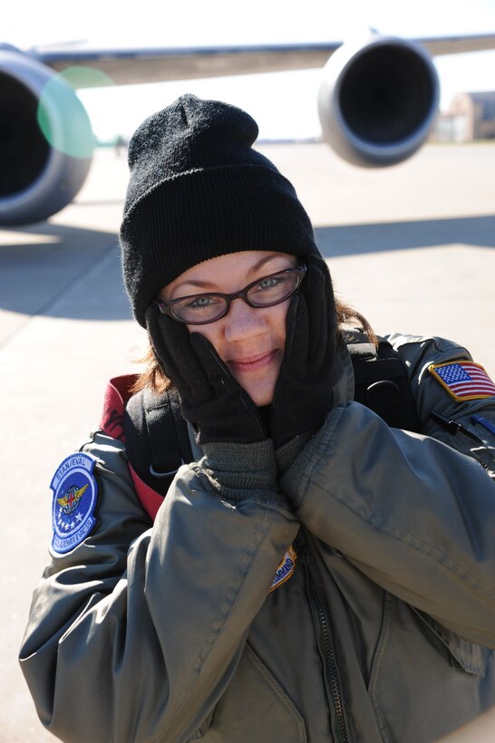 932nd Airlift Wing honor guard coordinator and 932nd Aeromedical Evacuation member, Master Sgt. Tonya Hupp, braces from the cold Illinois wind blowing on the flightline.  She and other members braved the below-freezing chill to load their equipment on a plane before taking off recently to train.  She reminds wing members that the honor guard is now open to both officers and enlisted.  (U.S. Air Force photo/Maj. Stan Paregien)
