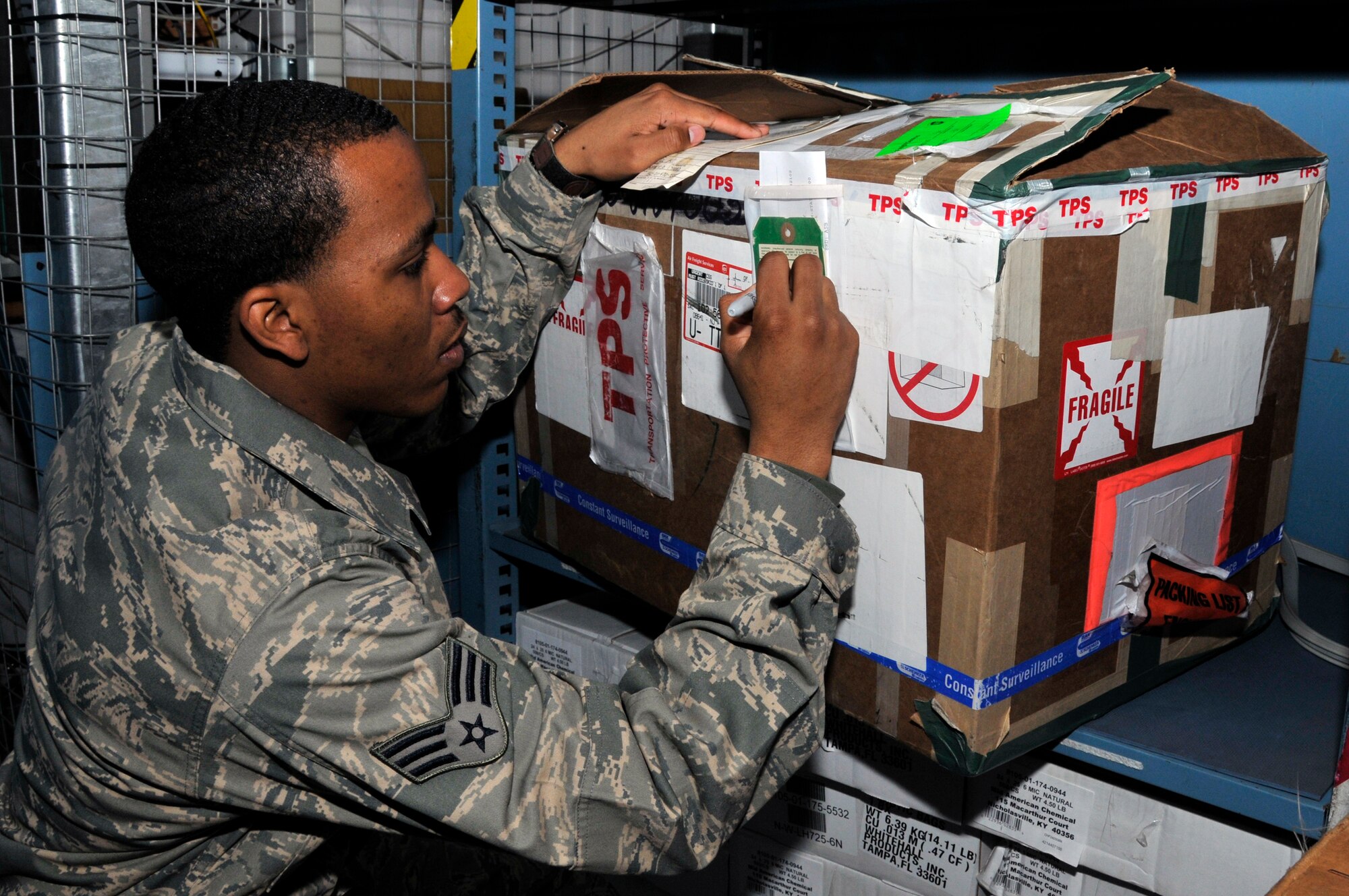 Senior Airman Douglas Cornelius, 48th Logistics Readiness Squadron flight service center technician, verifies the part is the correct one and prepares it to be shipped to a repair depot Sept. 8 at RAF Lakenheath, England. The flight service center verifies process’s and monitors all documentation for 38 maintenance back shops.  (U.S. Air Force photo by Airman 1st Class Perry Aston) 