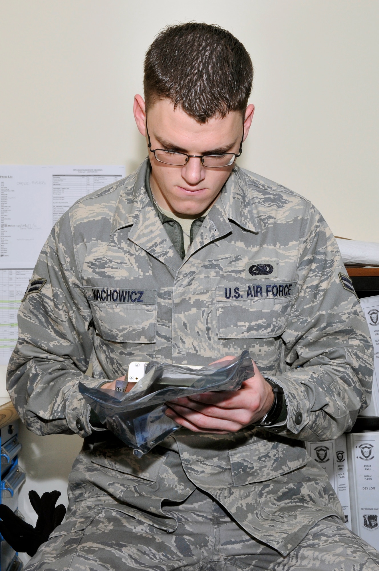 Airman 1st Class Andrew Wachowicz, 48th Logistics Readiness Squadron flight service center technician, verifies the part that is being turned in matches the paperwork, Nov. 14 at RAF Lakenheath, England. The flight service center verifies, process’s and monitors all documentation for aircraft parts that require maintenance action.  (U.S. Air Force photo by Airman 1st Class Perry Aston) 