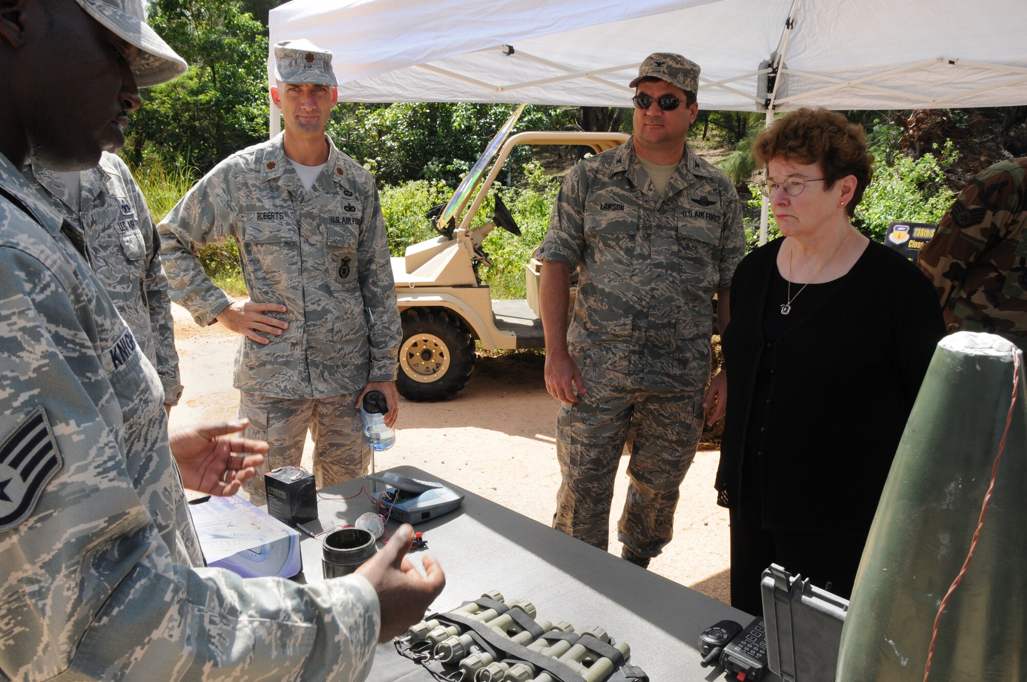 ANDERSEN AIR FORCE BASE, Guam - Staff Sgt. Milton Knight, 736th Security Forces Squadron explains the various types of Improvised Explosive Devices used downrange to Mrs. Natalie Crawford, Senior Fellow of the Research and Development Corporation and Senior Mentor for the U.S. Air Force Scientific Advisory Board during her visit here Dec. 17.  (U.S. Air Force photo by Senior Airman Nichelle Griffiths)