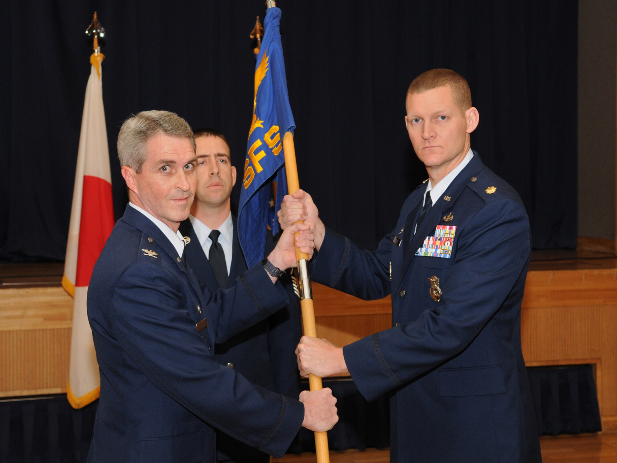 MISAWA AIR BASE, Japan -- Maj. Dustin G. Sutton assumes command of the 35th Security Forces Squadron, during a ceremony Dec. 15, 2008. Major Sutton, who came from Scott Air Force Base, Ill., served as the executive officer to the Director of Installations and Mission Support, Headquarters Air Mobility Command. The presiding officer for the ceremony was Col. Mark Burns, 35th Mission Support Group commander. (U.S. Air Force photo by Senior Airman Jamal D. Sutter)