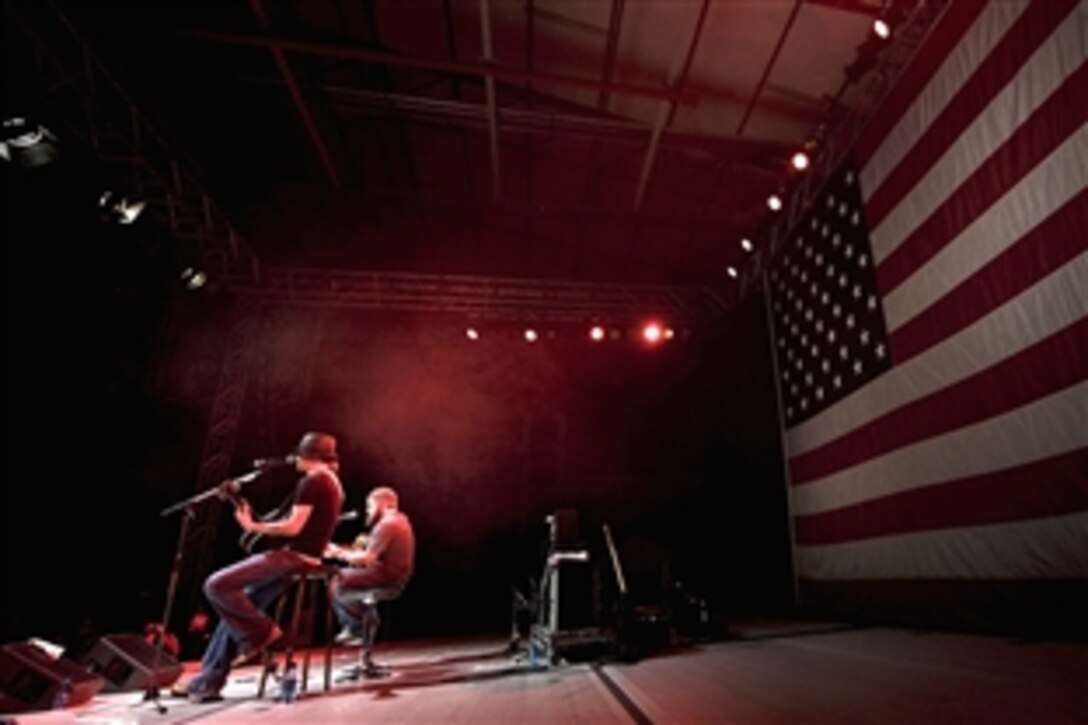 Grammy award-winning musician Kid Rock and his guitarist Zac Brown perform for servicemembers, Dec. 16, during the 2008 USO Holiday Tour at Ramstein Air Base, Germany. 
