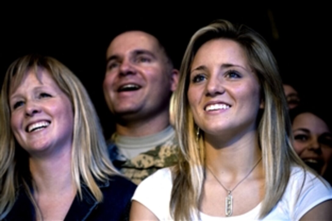 Servicemembers and their families enjoy the comedy of Lewis Black, Dec. 16, during the 2008 USO Holiday Tour on Ramstein Air Base, Germany. 
