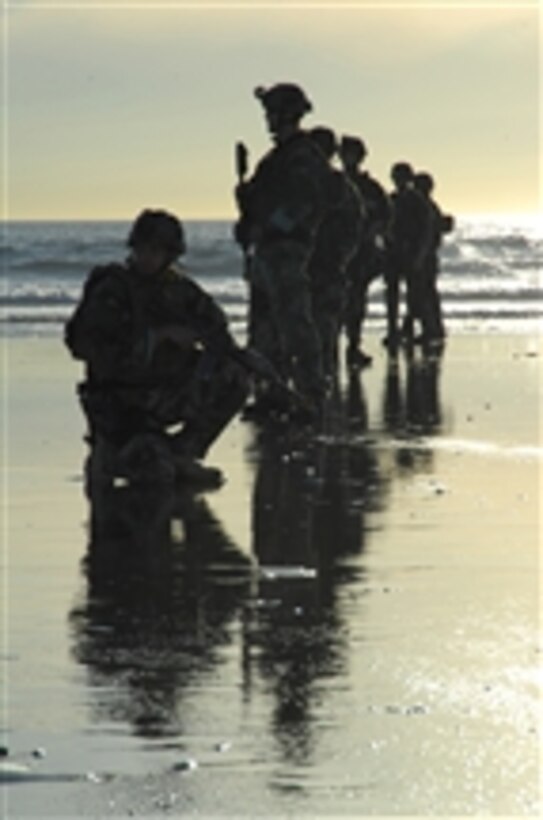 U.S. Navy special warfare combatant-craft crewmen from Special Boat Team 12 prepare to patrol a beach during a casualty assistance and evacuation scenario at the Naval Special Warfare Center in Coronado, Calif., on Dec. 10, 2008.  The scenario covered basic first aid and advanced life-saving skills commonly used to treat combat-related injuries as part of unit-level training.  
