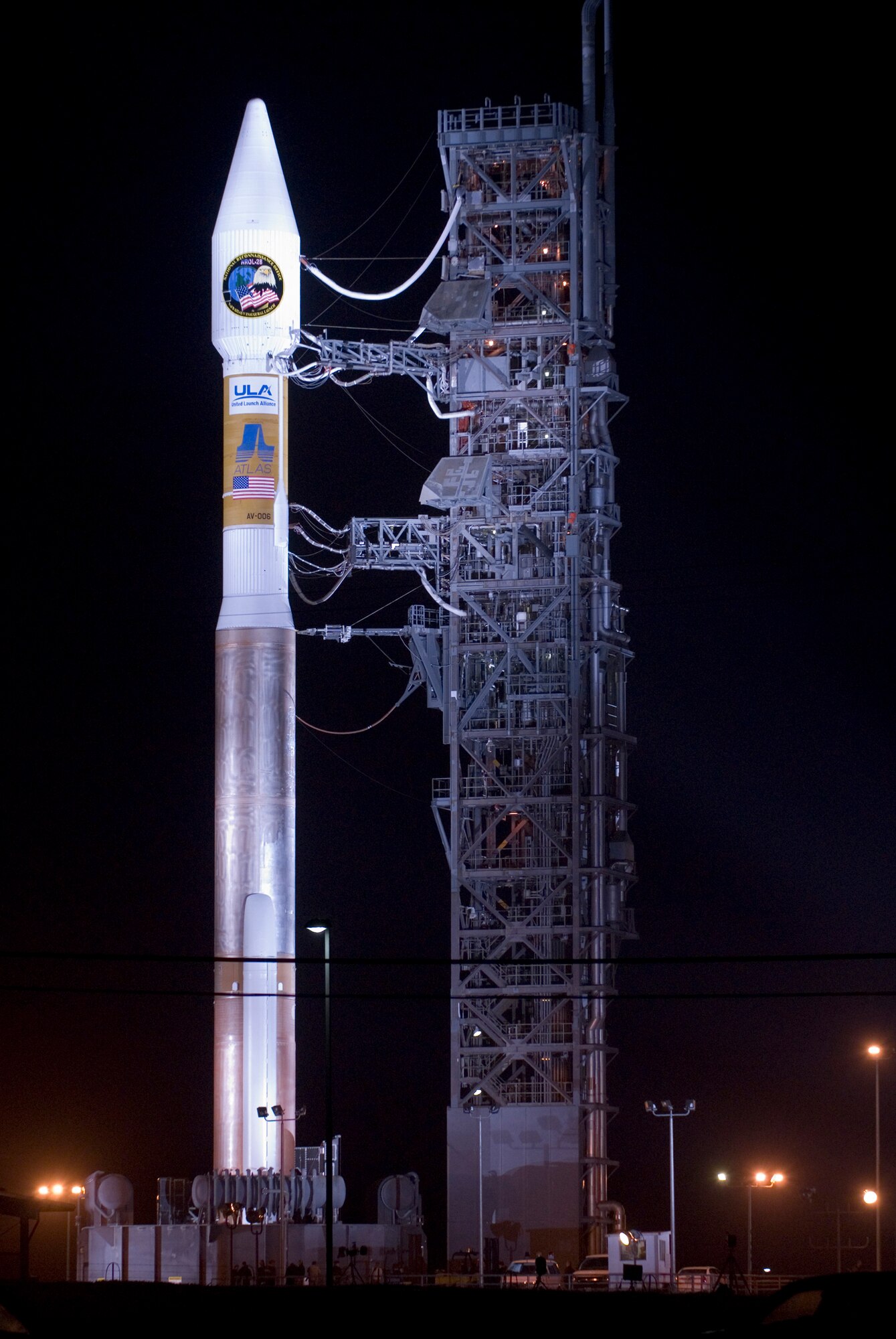 VANDENBERG AIR FORCE BASE, Calif. -- An Atlas V stands on Space Launch Complex-3 during its mobile servicing tower rollback on March 12. This was the first Atlas V launched from Vandenberg and the west coast, as well as the first launch of the year. This milestone for Team Vandenberg was the product of the combined efforts of the 30th Space Wing, the National Reconnaissance Office, United Launch Alliance, the Space and Missile Systems Center, the Aerospace Corporation and more. SLC-3 was significantly modified to get ready for the next generation of space launch vehicles. The pad received significant upgrades to accommodate the larger and more powerful booster. The tower was made taller, the overhang was extended with a much bigger crane, and the entire pad deck was reconfigured. The pad also featured a brand new fixed launch platform. (U.S. Air Force photo/Airman 1st Class Andrew Satran)