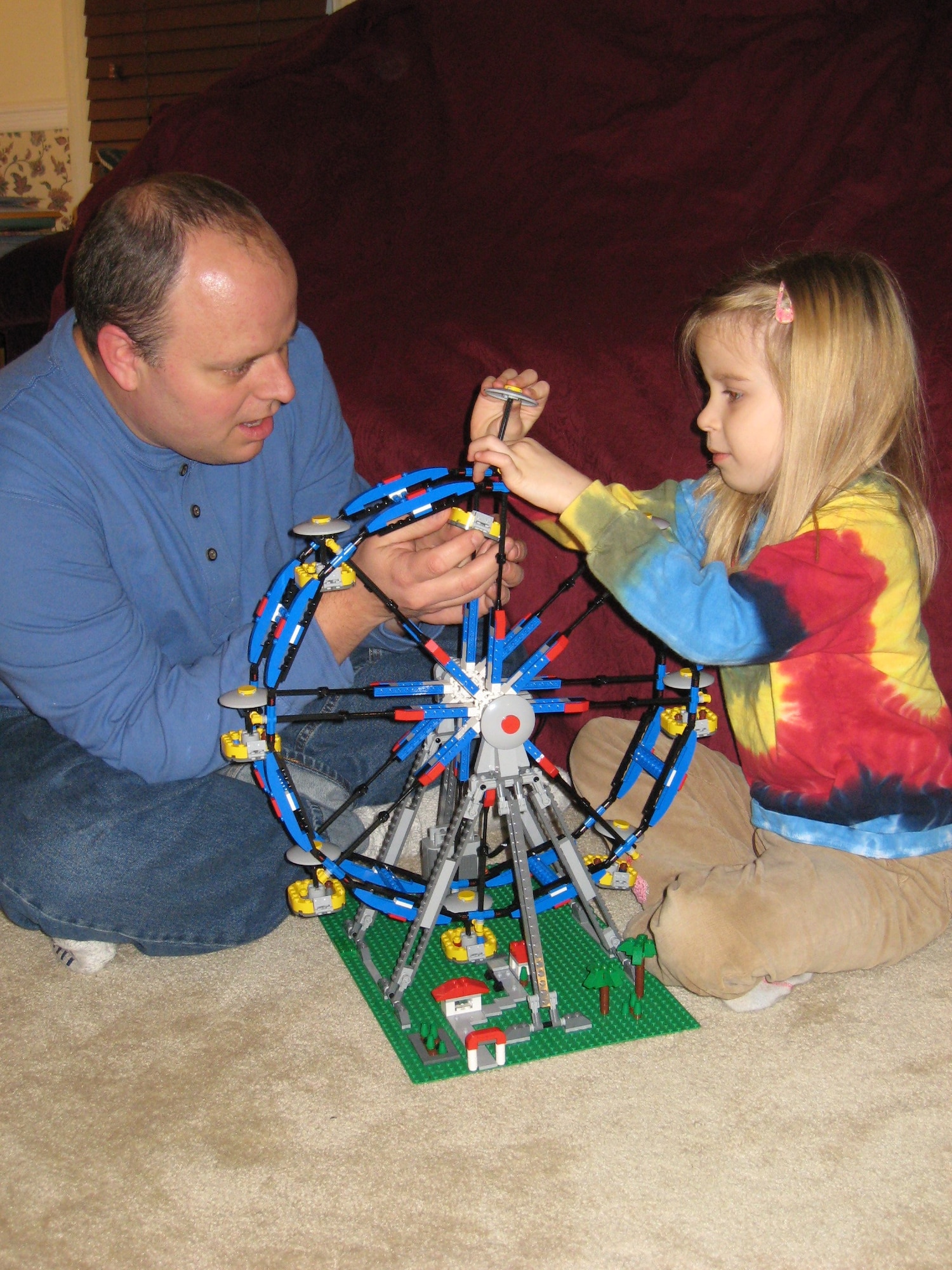 Aerospace Testing Alliance's (ATA) Will Vodra and his daughter Courtney assemble the last gondola on a Lego Ferris wheel. ATA is the support contractor for AEDC's Tunnel 9 facility, the NFAC and for the main complex in Tennessee.  (Photo provided)