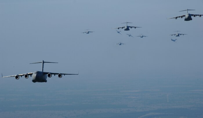 Charleston AFB C-17s fly as part of a 13-aircraft formation training exercise here Dec. 18.  The formation flight demonstrated the U.S. Air Force's strategic capability. The training mission included airdrops over North Auxiliary Airfield in Orangeburg, S.C., and aerial refueling training. (U.S. Air Force photo/Airman 1st Class Katie Gieratz)
