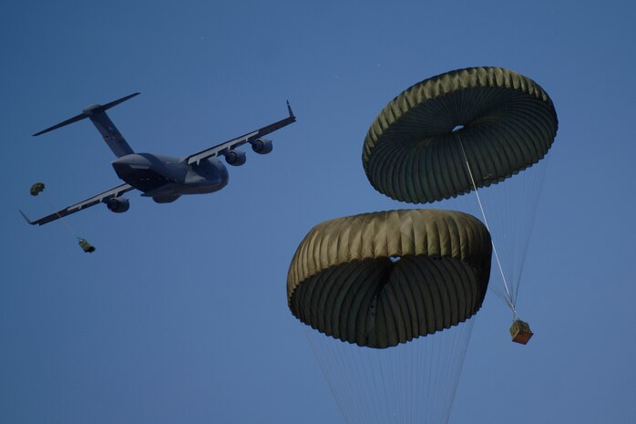 Charleston AFB C-17s perform an airdrop training mission as part of a 13-aircraft formation training exercise at North Auxiliary Field, Orangeburg, S.C., Dec 18. The formation flight demonstrated the U.S. Air Force's strategic capability. The training mission also included aerial refueling. (U.S. Air Force photo/Senior Airman Timothy Taylor)