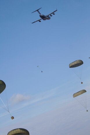 Charleston AFB C-17s perform an airdrop training mission as part of a 13-aircraft formation training exercise at North Auxiliary Field, Orangeburg, S.C., Dec 18. The formation flight demonstrated the U.S. Air Force's strategic capability. The training mission also included aerial refueling. (U.S. Air Force photo/Senior Airman Timothy Taylor)