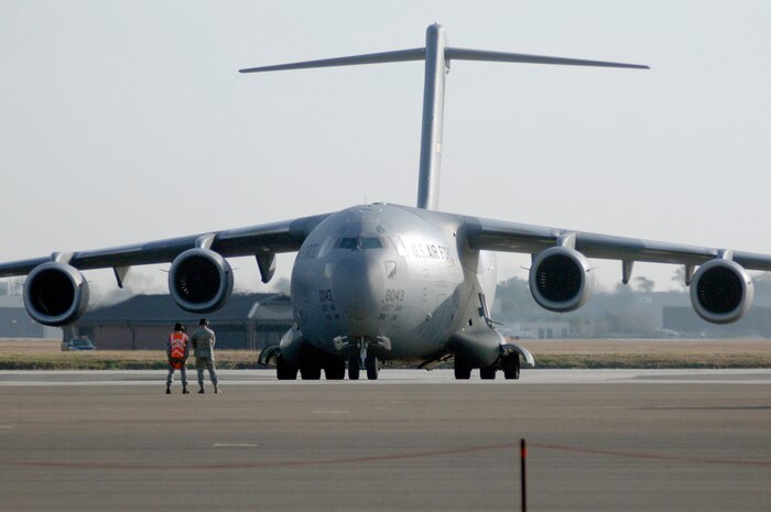 One of 13 C-17's sits on the flight line prior to taxi as part of a 13 aircraft formation training mission Dec. 18 at Charleston AFB. The formation flight demonstrated the U.S. Air Force's strategic capability. The training mission included airdrops over North Auxiliary Airfield in Orangeburg, S.C., and aerial refueling training. (U.S. Air Force photo/Staff Sgt. Marie Cassetty)