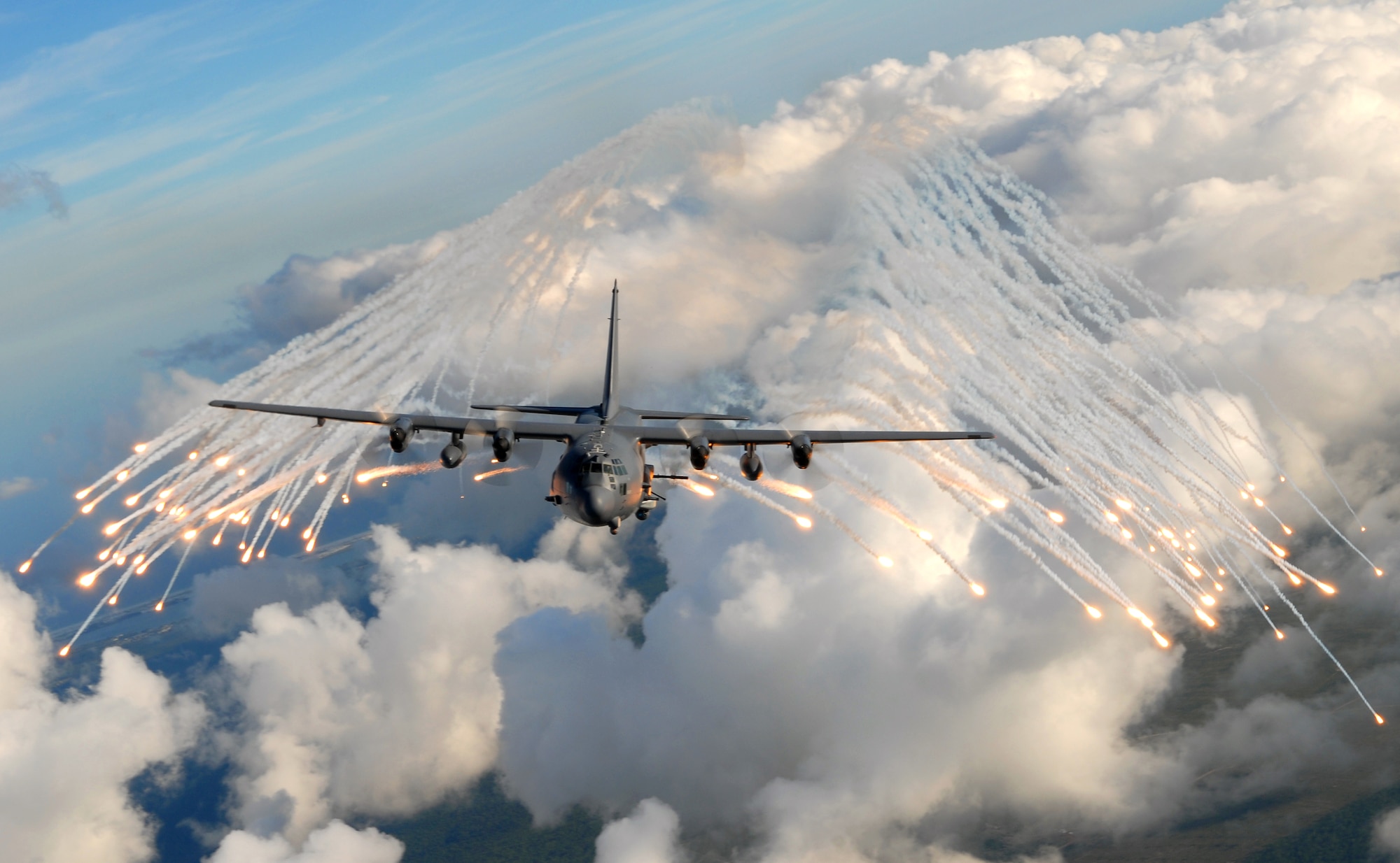 HURLBURT FIELD, Fla. -- An AC-130U gunship from the 4th Special Operations Squadron, jettisons flares over an area near Hurlburt Field, Fla., Aug. 20. The flares are a countermeasure for heat seeking missiles that may be launched at the aircraft during real world missions. (U.S. Air Force photo/ Senior Airman Julianne Showalter)