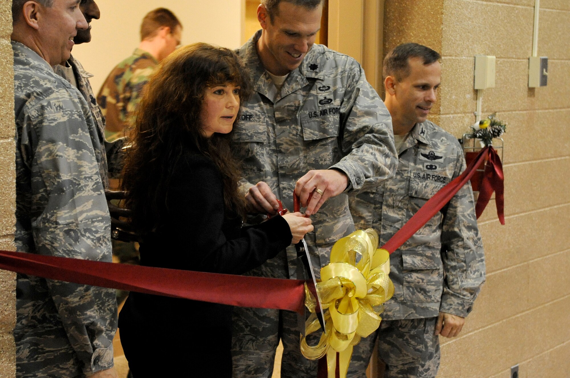 The Professional Development Center (Education Office) staff finalized it’s move to the McGuire AFB Falcon Court North area with a Ribbon Cutting ceremony and Informational Fair Dec. 11. Ribbon cutters from left to right are Col. Michael Carrell, 305th Mission Support Group commander, Linda Richardson, education services officer, Lt. Col. Christopher Wyckoff, 305th Mission Support Squadron commander, and Col. Brian O’Connor, 621st Contingency Response Wing commander. (U.S. Air Force photo/Wayne Russell)