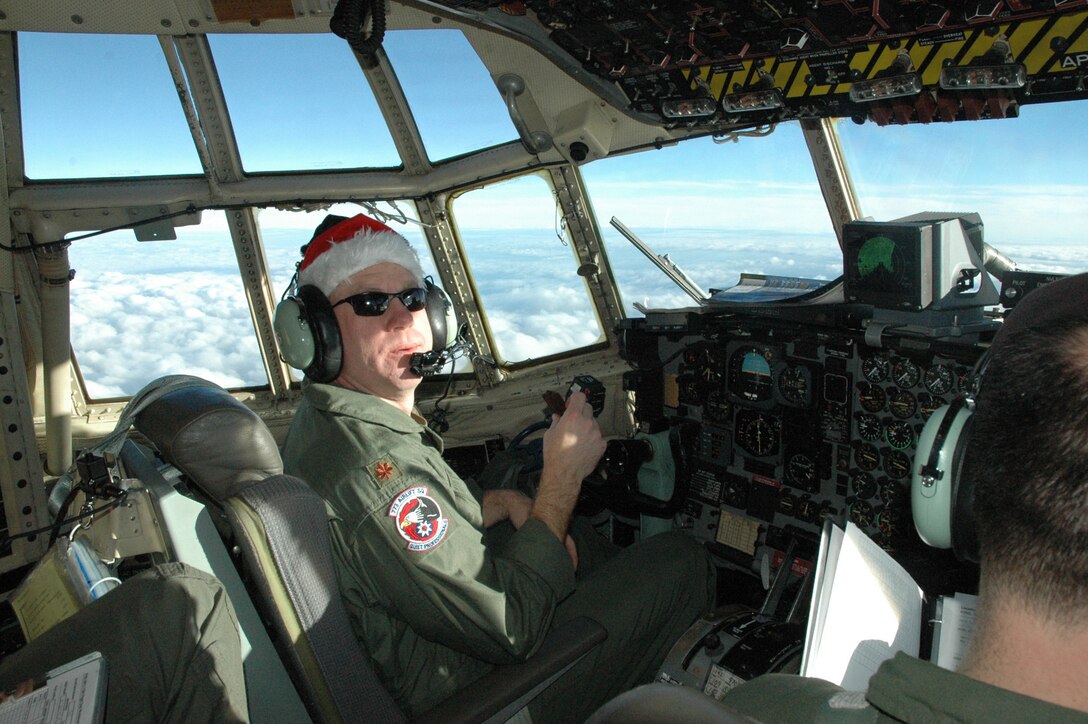 OVER THE CARIBBEAN SEA — Major Casey Keibler, a pilot with the 773rd Airlift Squadron, enthusiastically flies the donated clothing to the needy people of the Dominican Republic.
